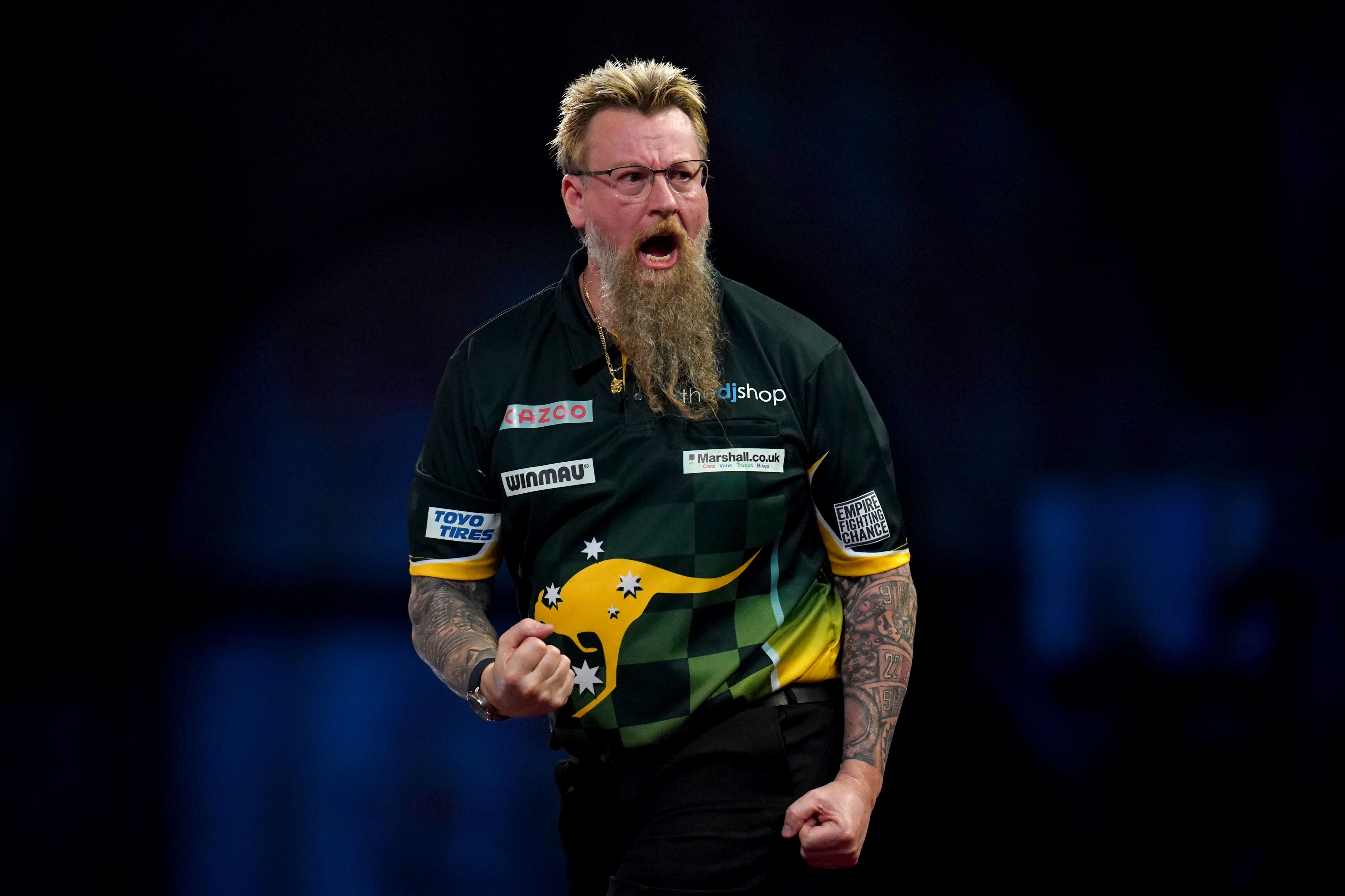 Simon Whitlock edged into the second round at Alexandra Palace (John Walton/PA)