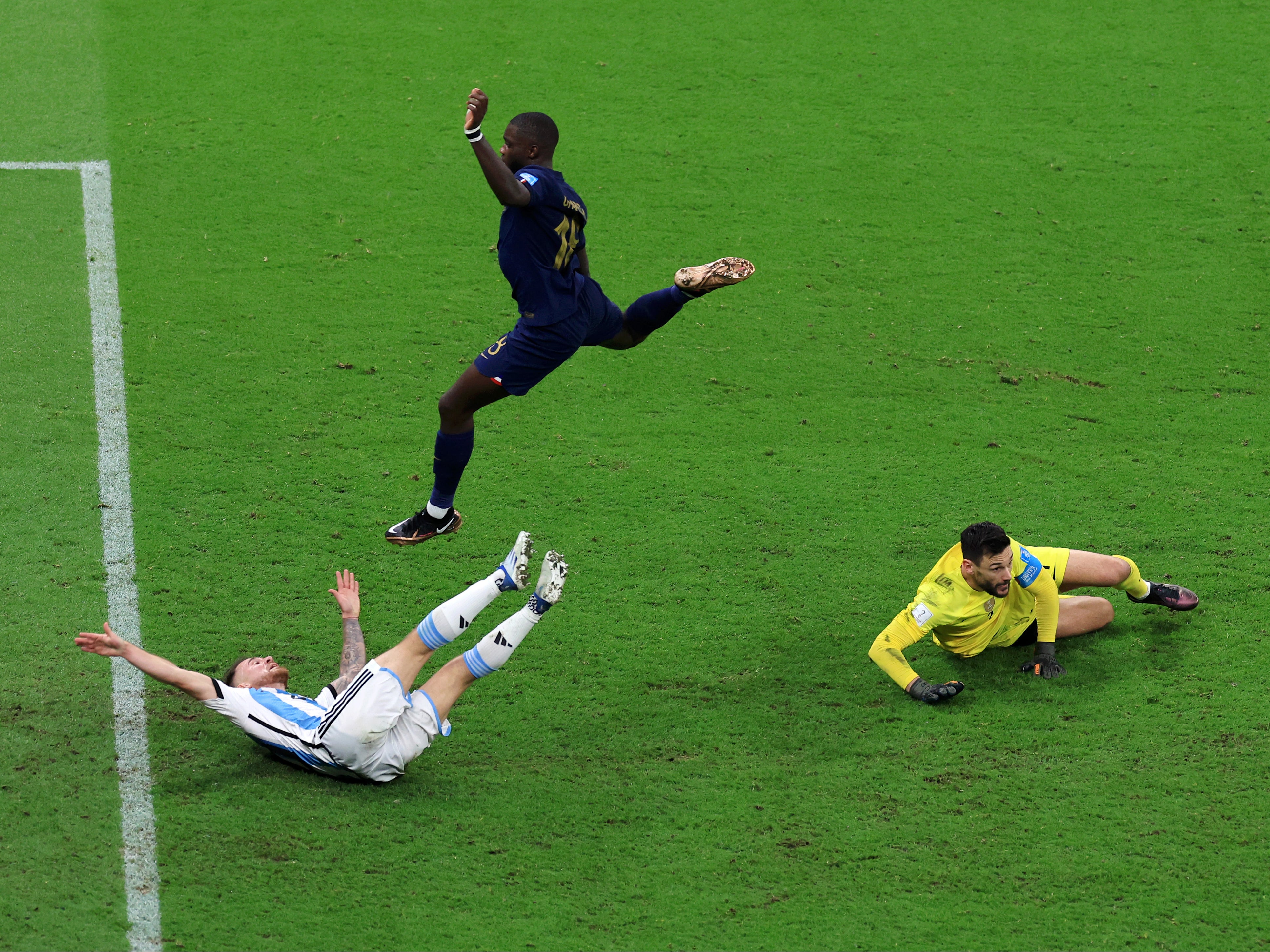 Alexis Mac Allister lands on the floor after Hugo Lloris makes a save against