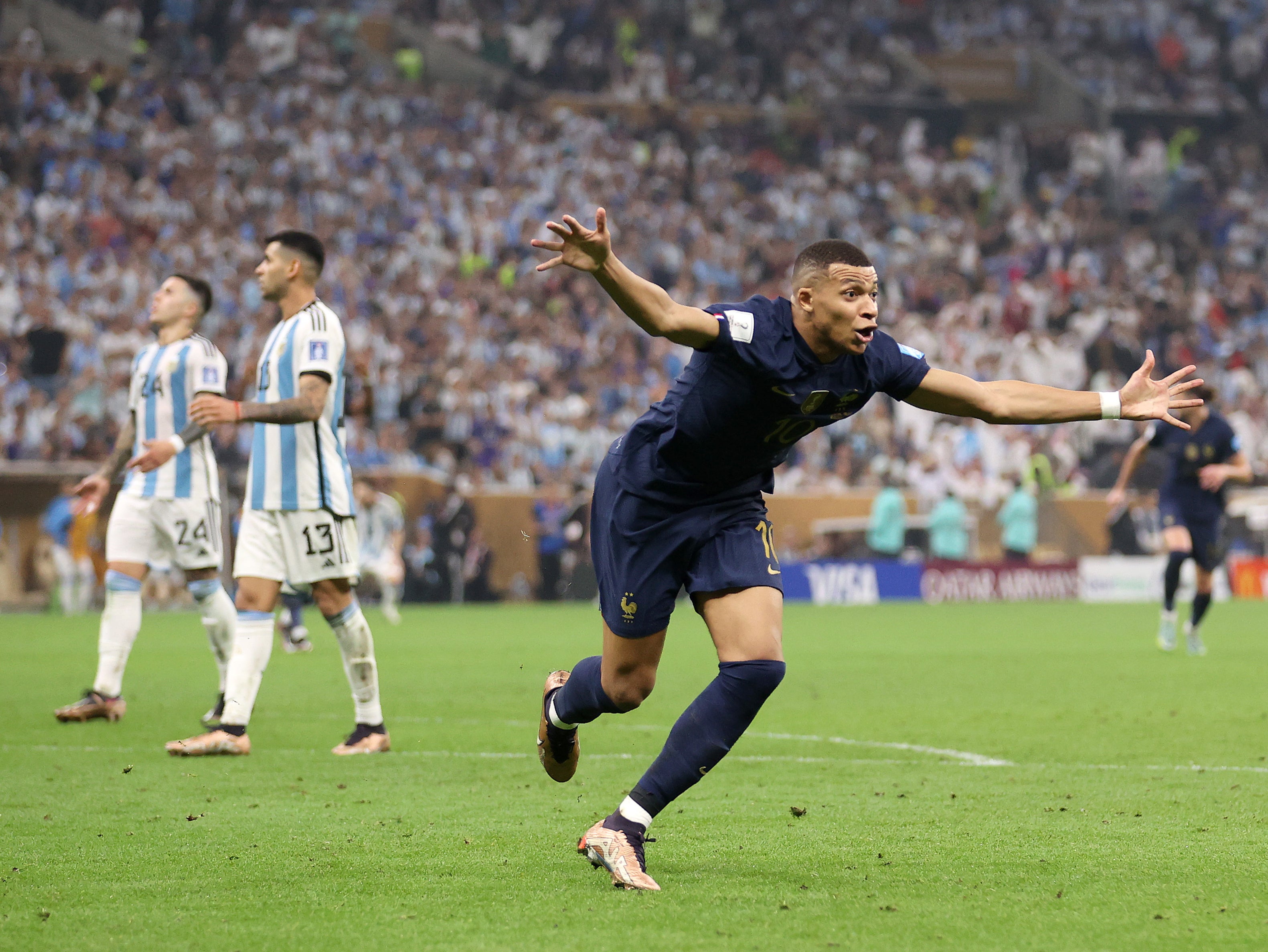 Kylian Mbappe wheels away after equalising