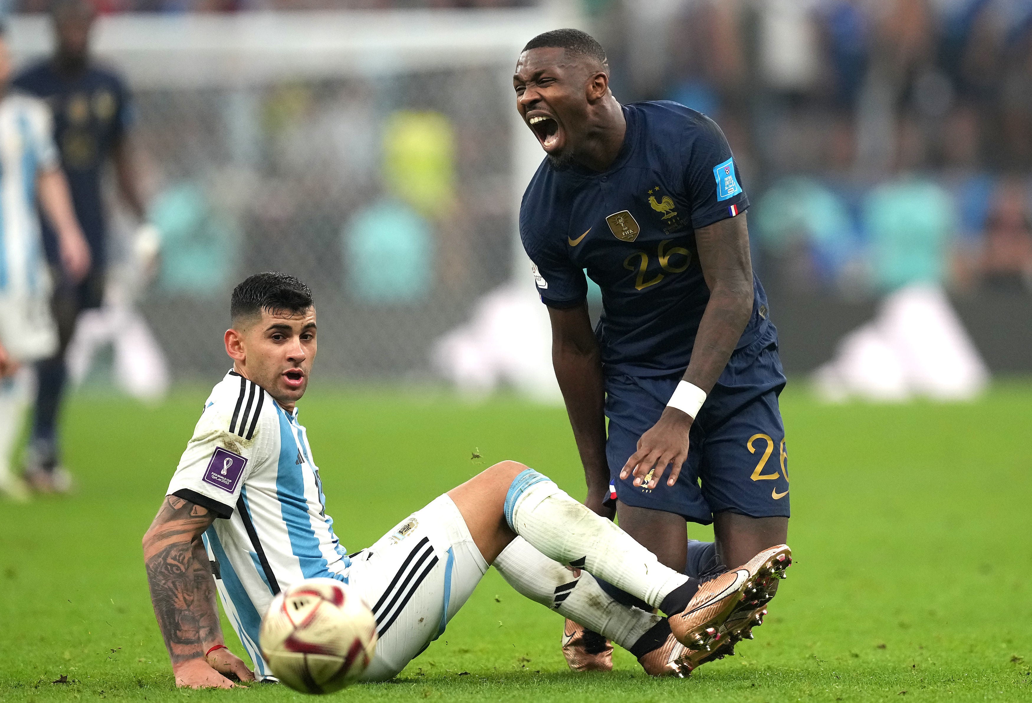 Marcus Thuram reacts after being tackled by Cristian Romero