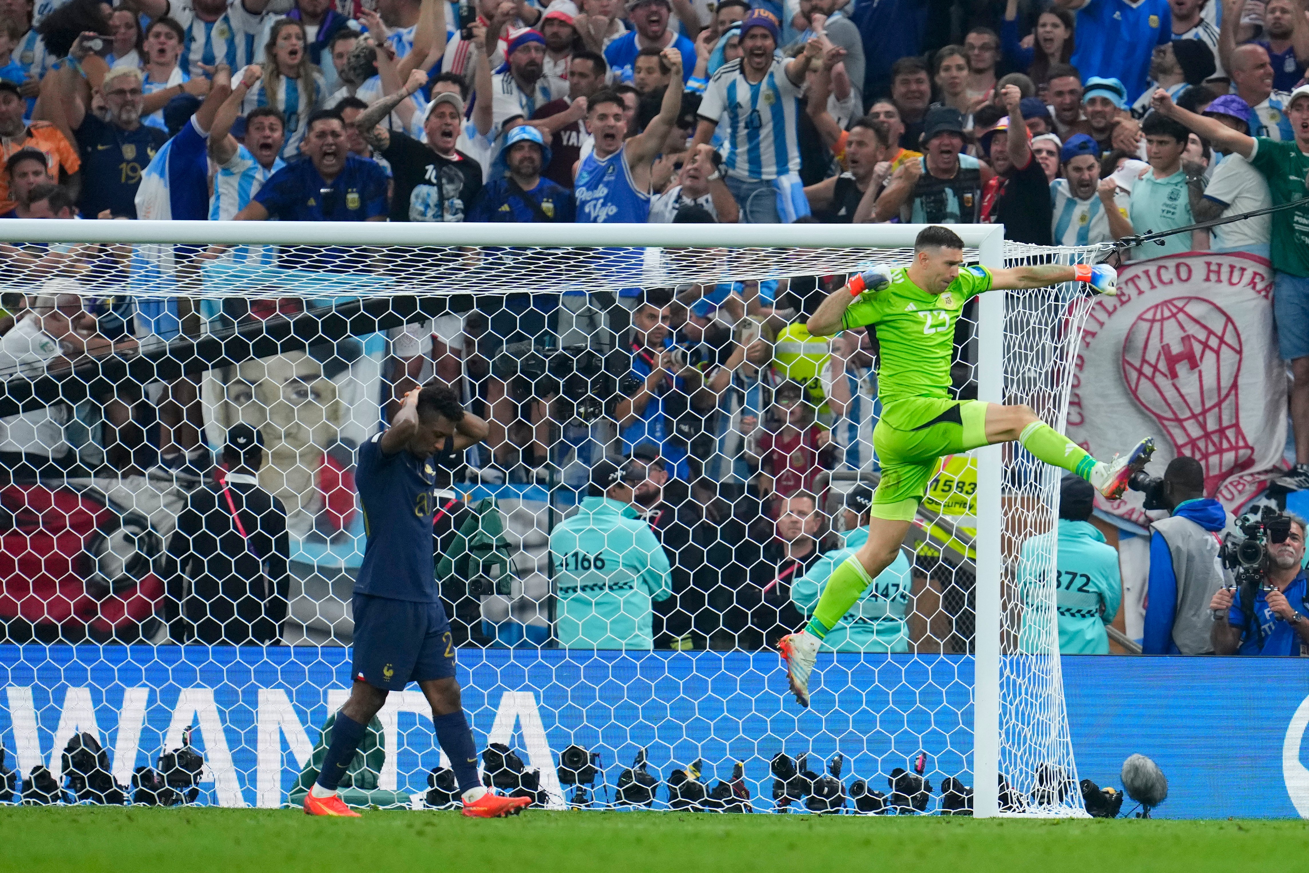 Martinez celebrates after saving a shootout penalty