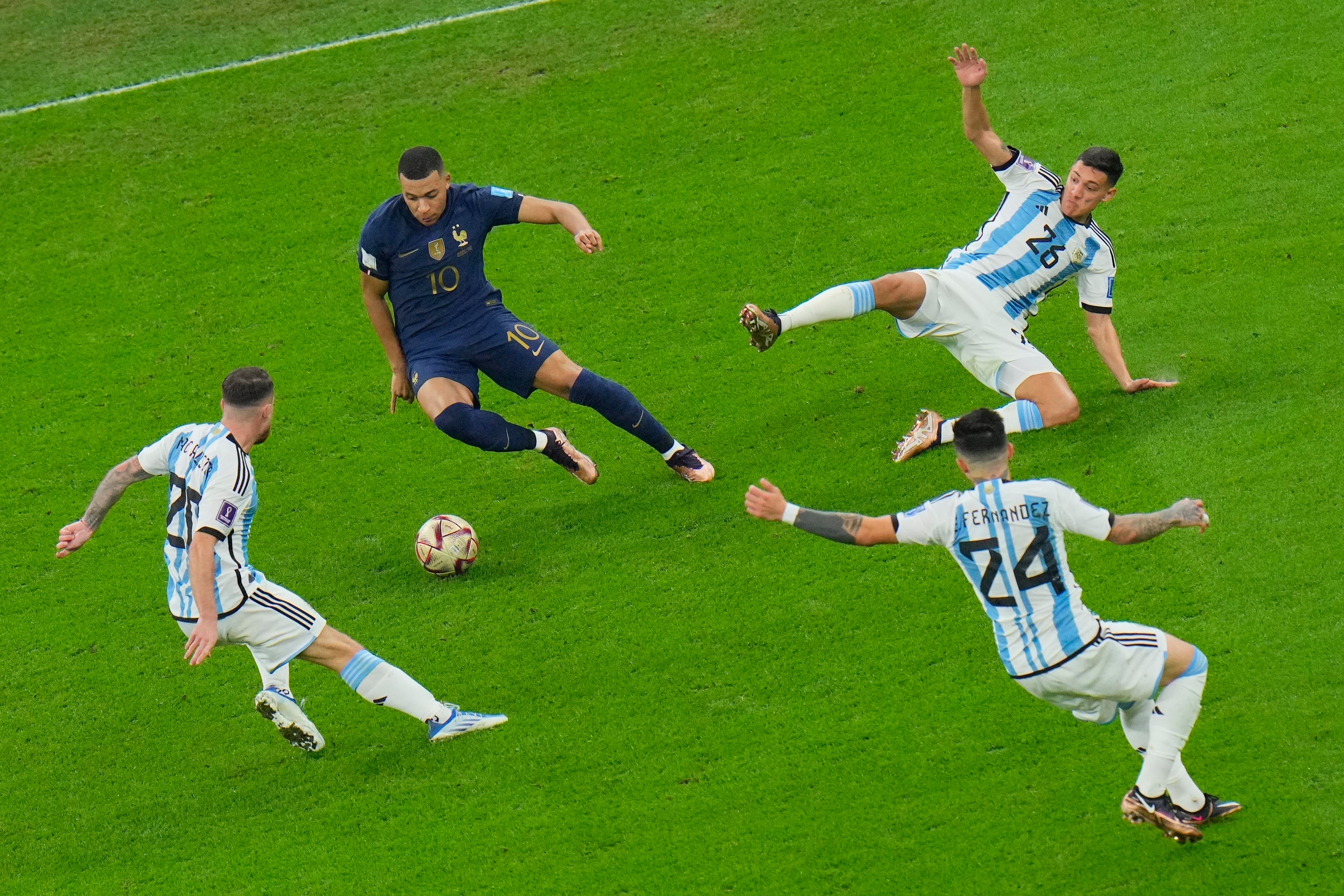 Mbappe, centre, holds the ball against the Argentine side