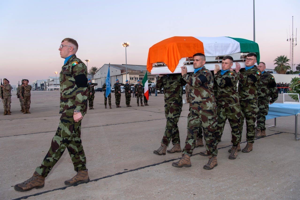 Private Sean Rooney’s coffin is carried onto the plane for the flight home (PA)