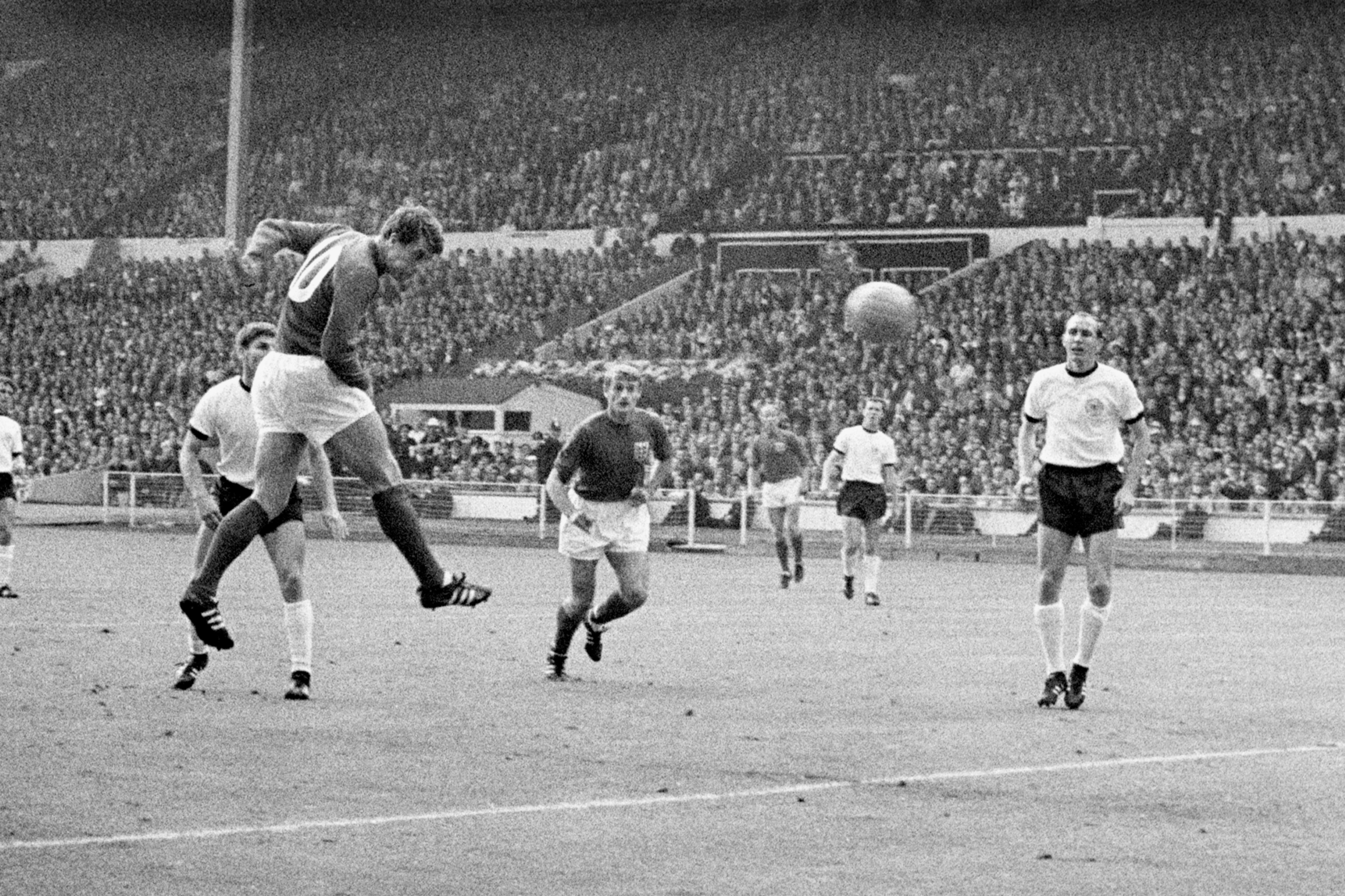 Geoff Hurst heads the equaliser in the 1966 World Cup final, the first of his three goals