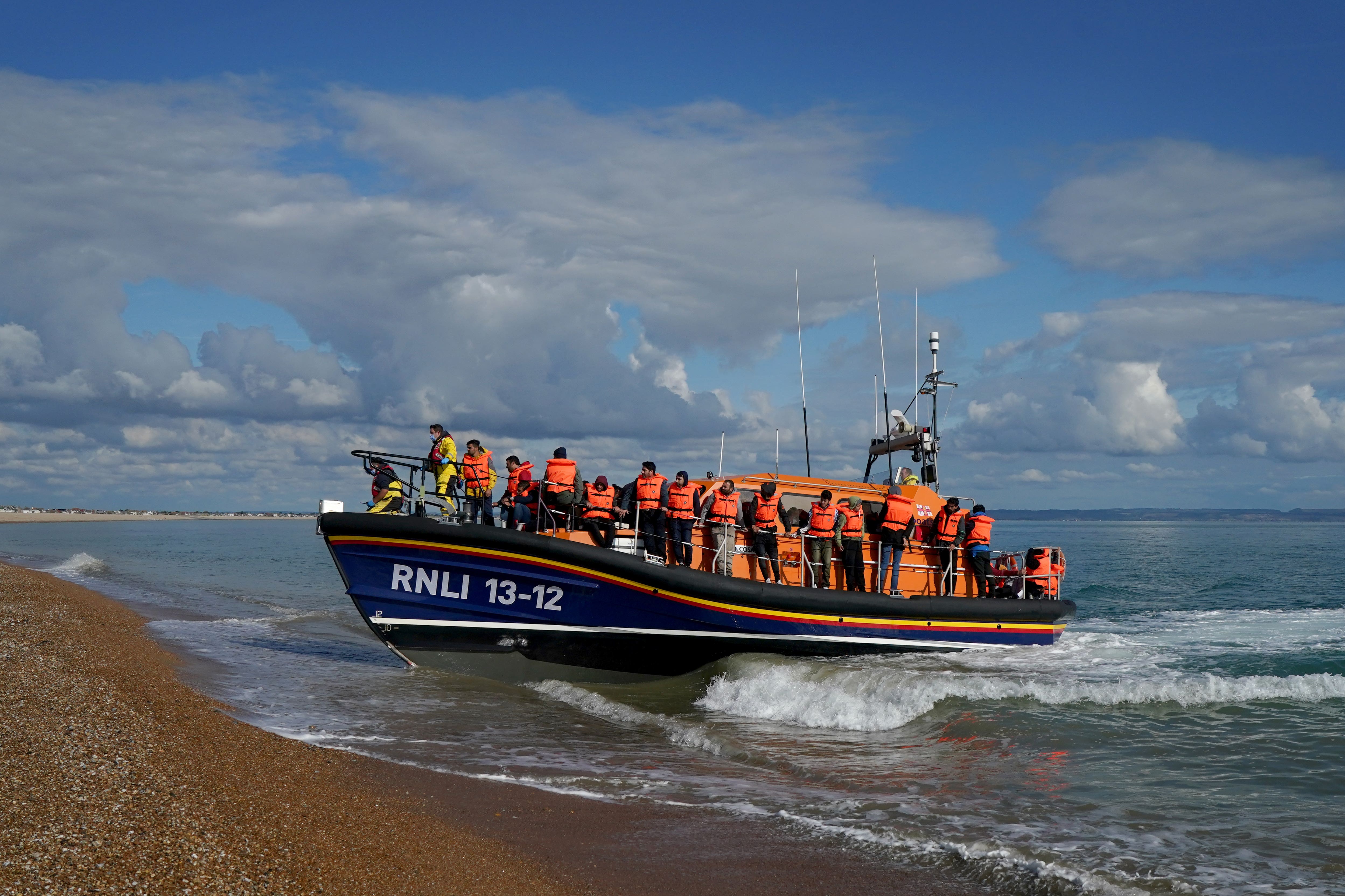 A group of people thought to be migrants are brought in to Dungeness, Kent