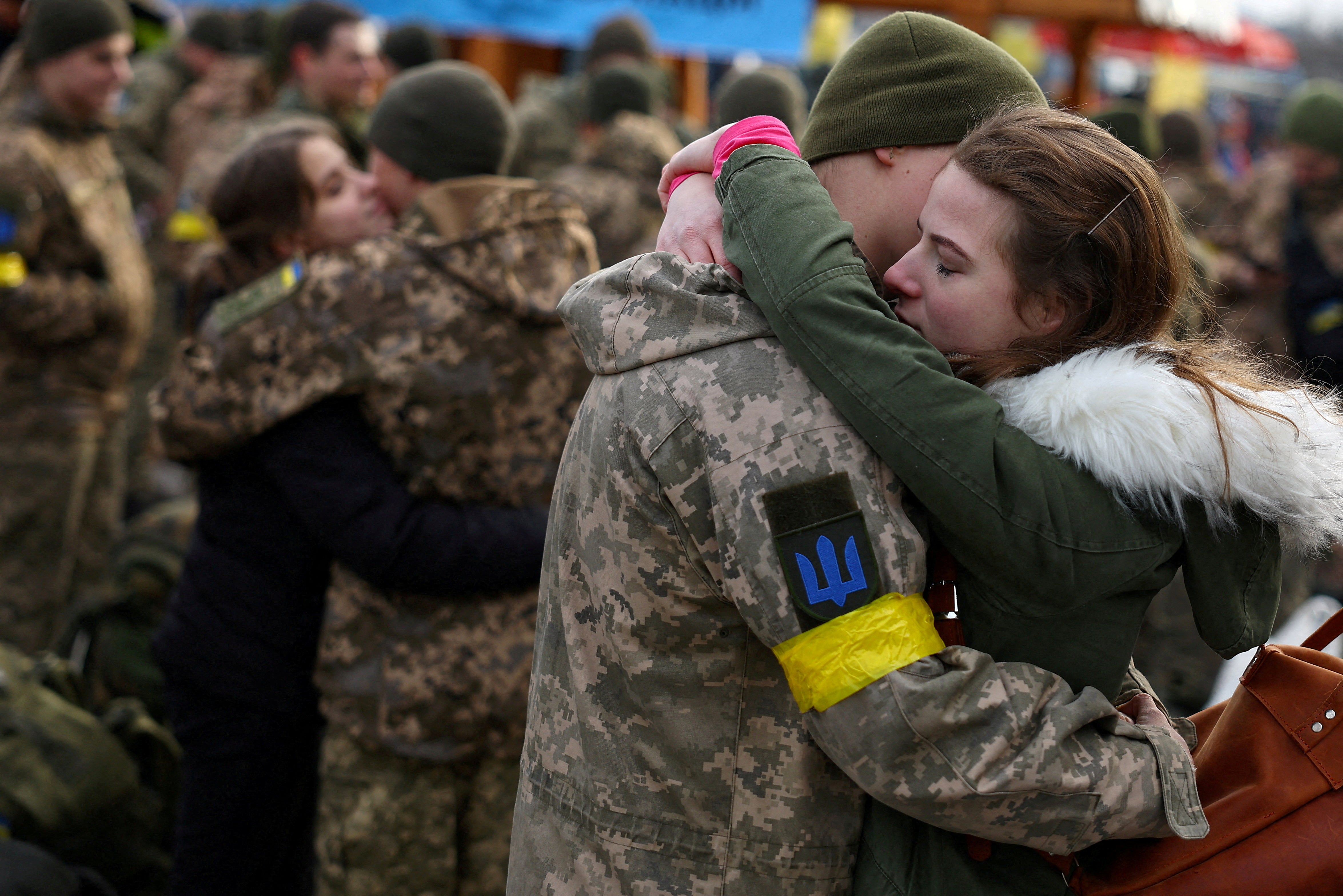 Olga hugs her boyfriend Vlodomyr as they say goodbye prior to his deployment closer to the front line at the train station in Lviv, Ukraine