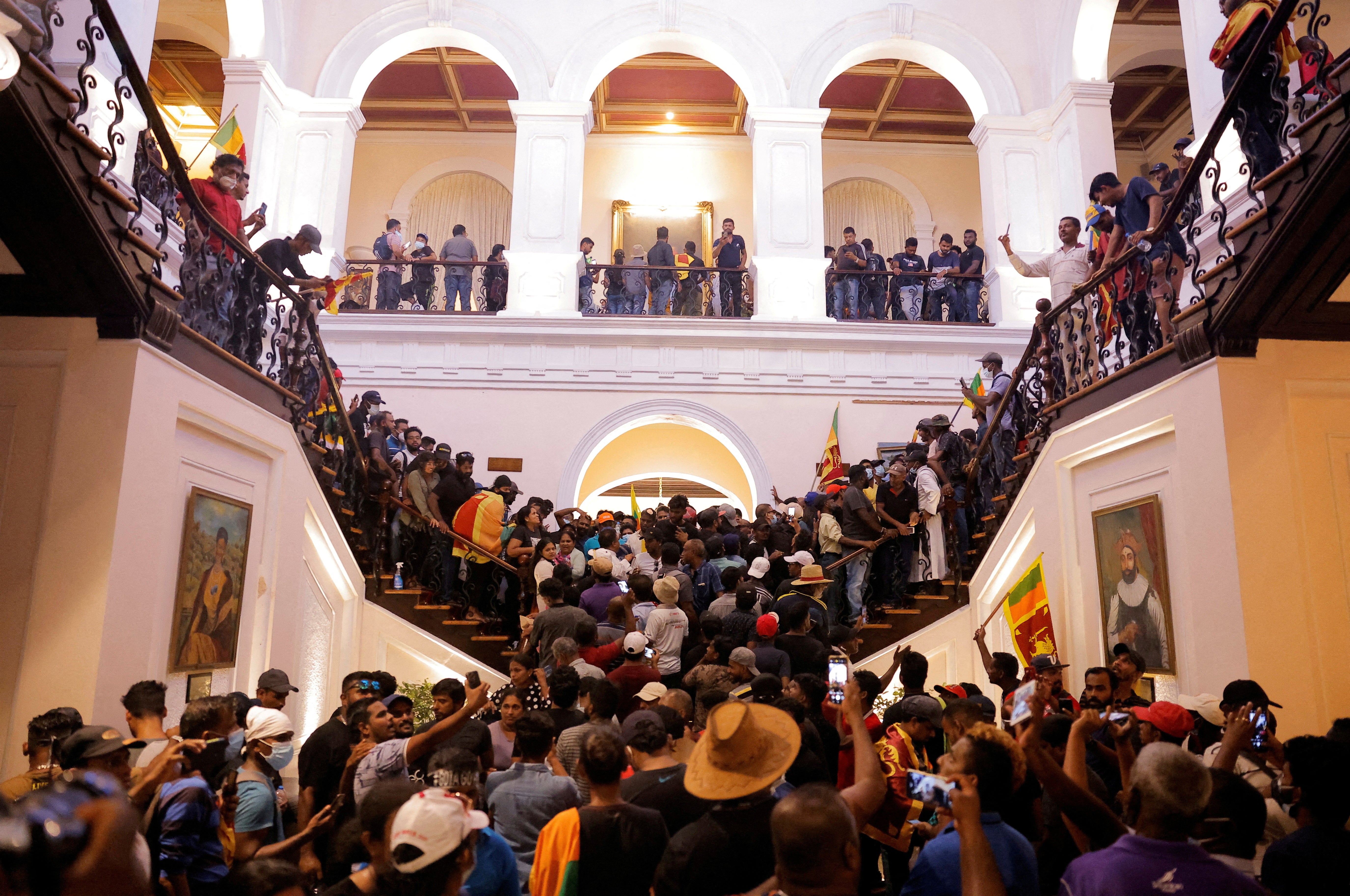 Demonstrators protest inside the President’s House, after President Gotabaya Rajapaksa fled, amid the country’s economic crisis, in Colombo, Sri Lanka