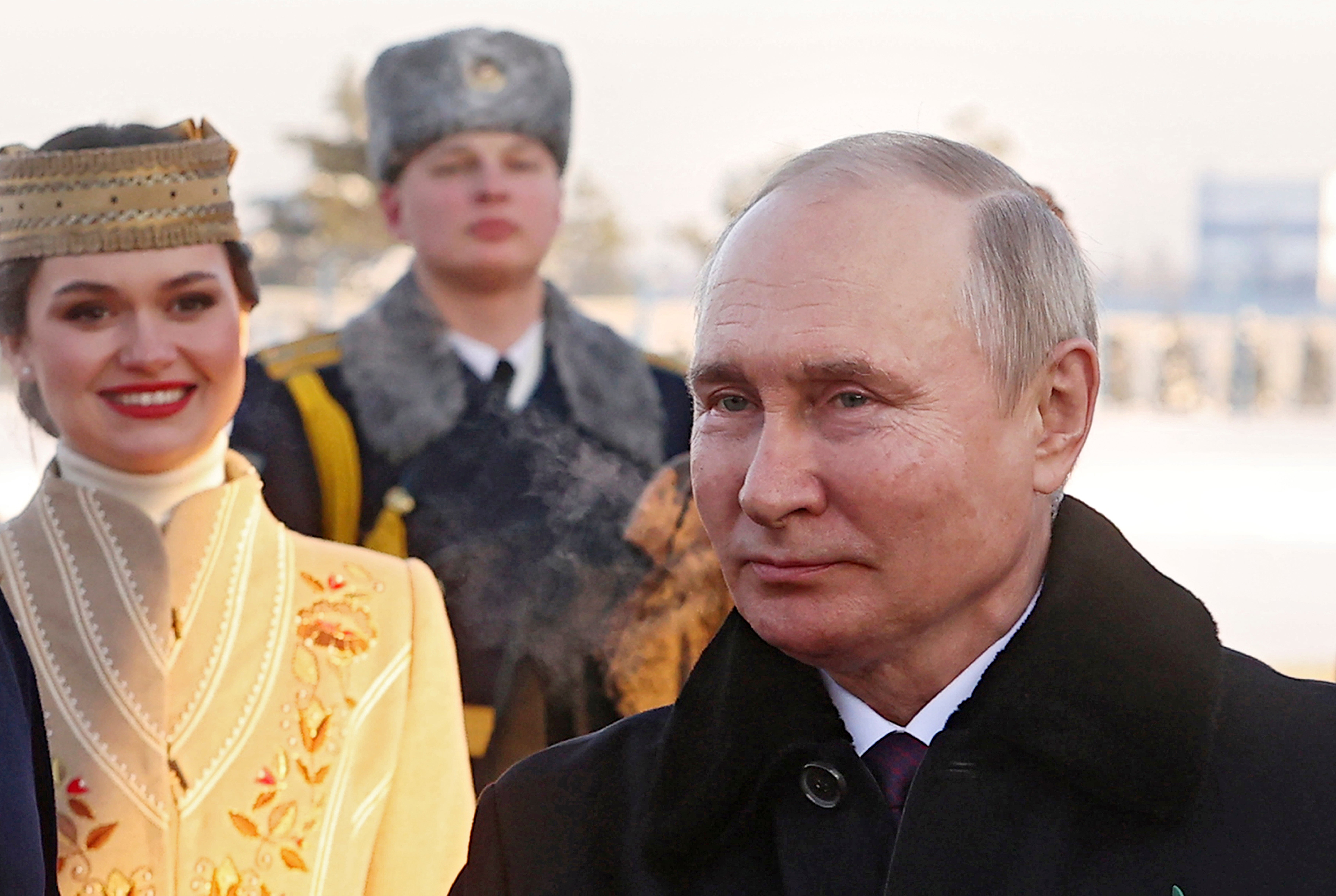 Vladimir Putin is welcomed to Belarus at the airport in Minsk on Monday