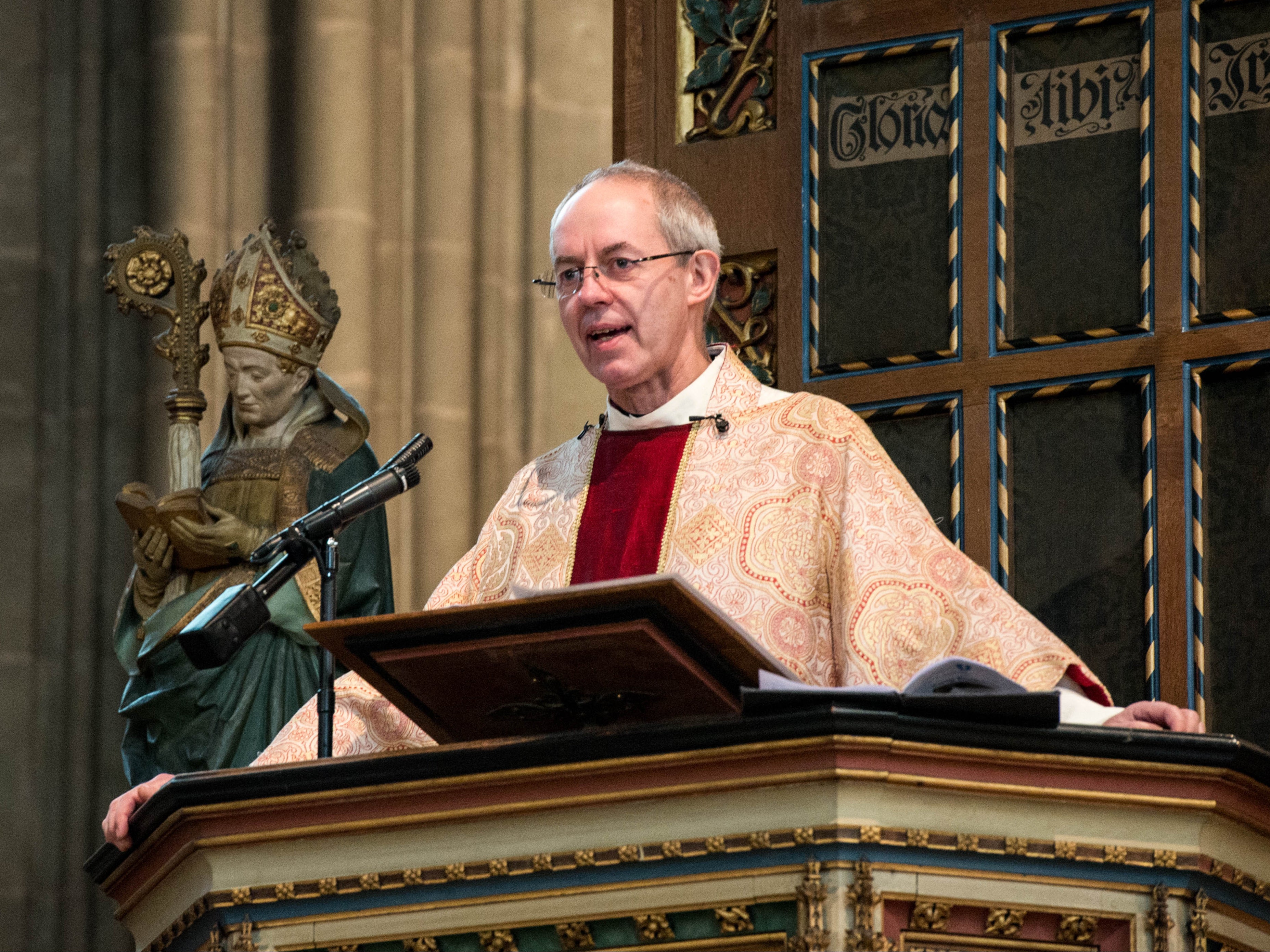 The Archbishop of Canterbury Justin Welby delivering a sermon from a pulpit