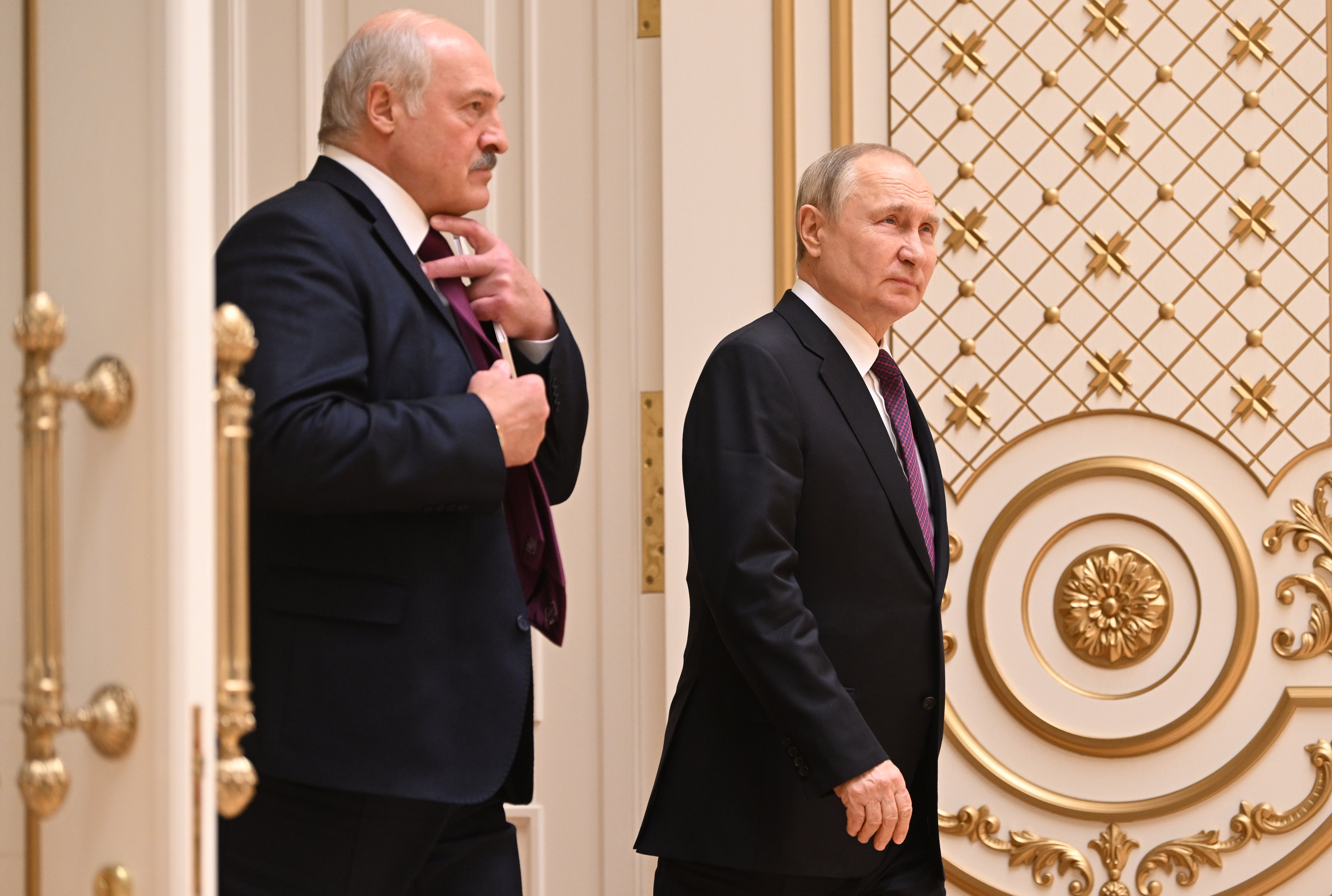 Mr Lukashenko and Mr Putin after talks at the Palace of Independence