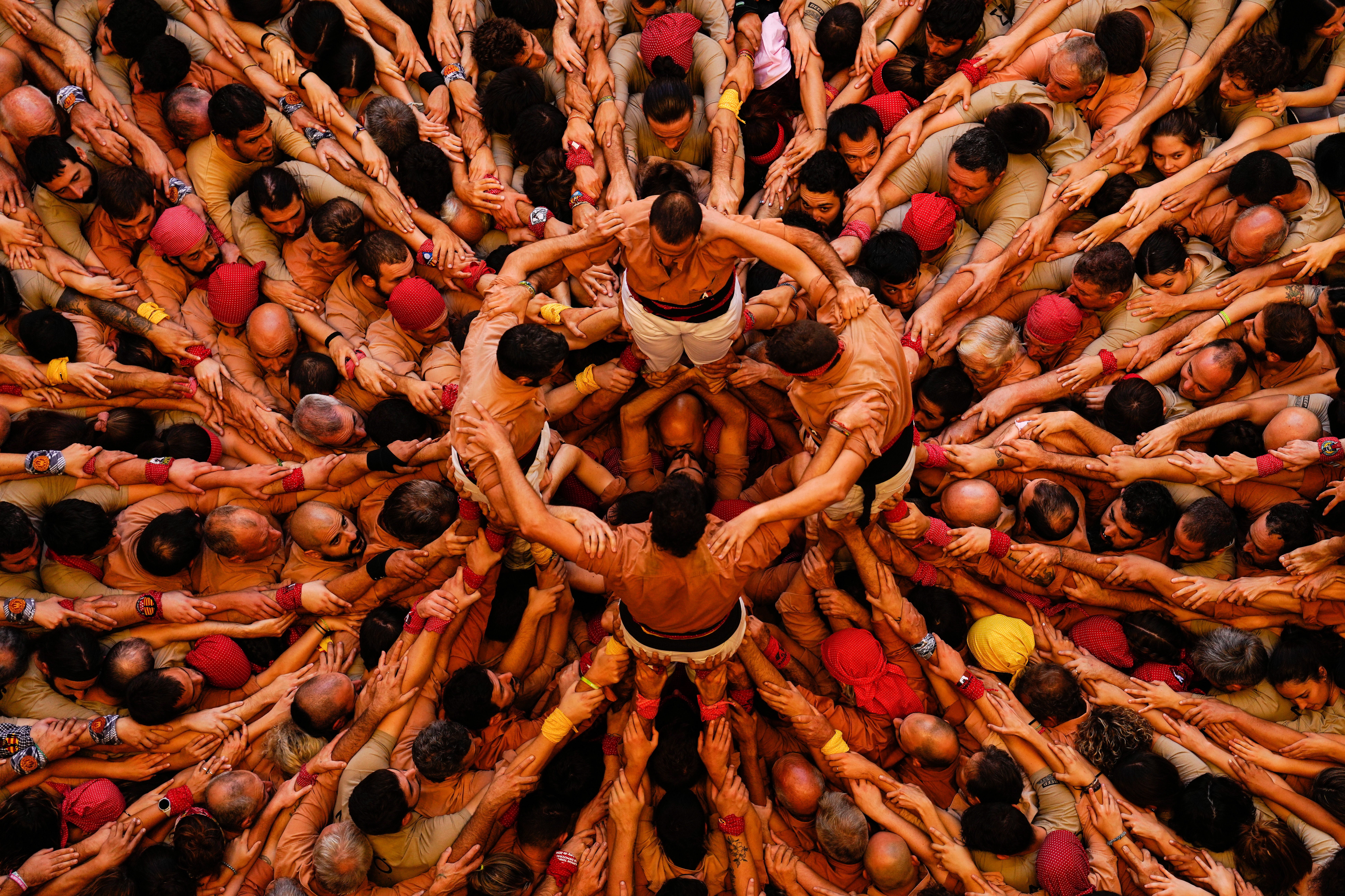 Members of the ‘Colla Xiquets de Reus’ team form their human tower during the Castells contest final in Tarragona, Catalonia, Spain