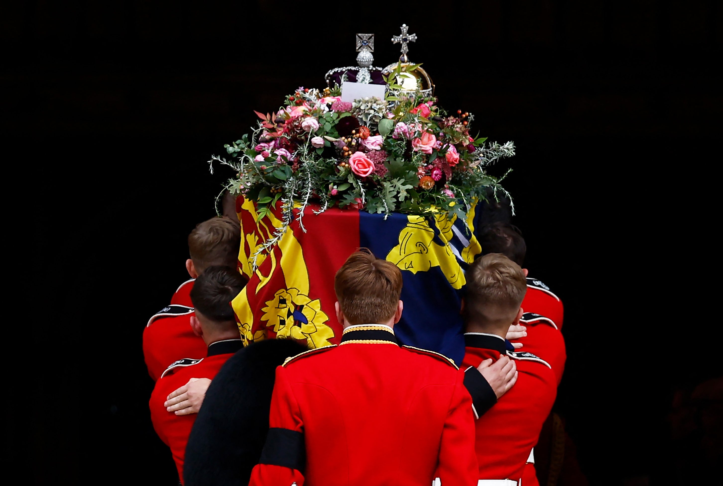 The Bearer Party take the coffin of Queen Elizabeth II into St George’s Chapel, inside Windsor Castle for the committal service