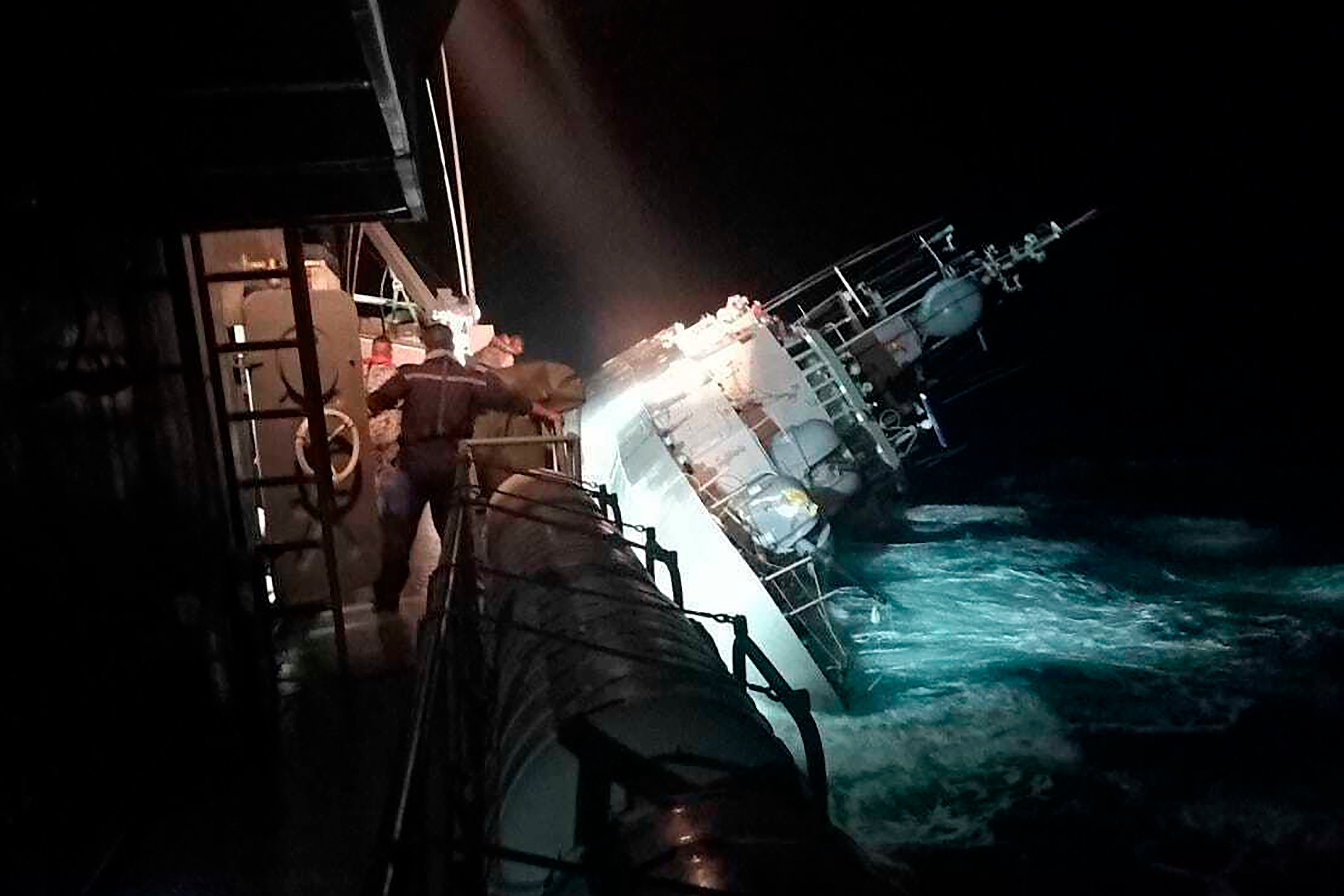 The HTMS Sukhothai corvette warship lists off the coast of Prachuap Khiri Khan province