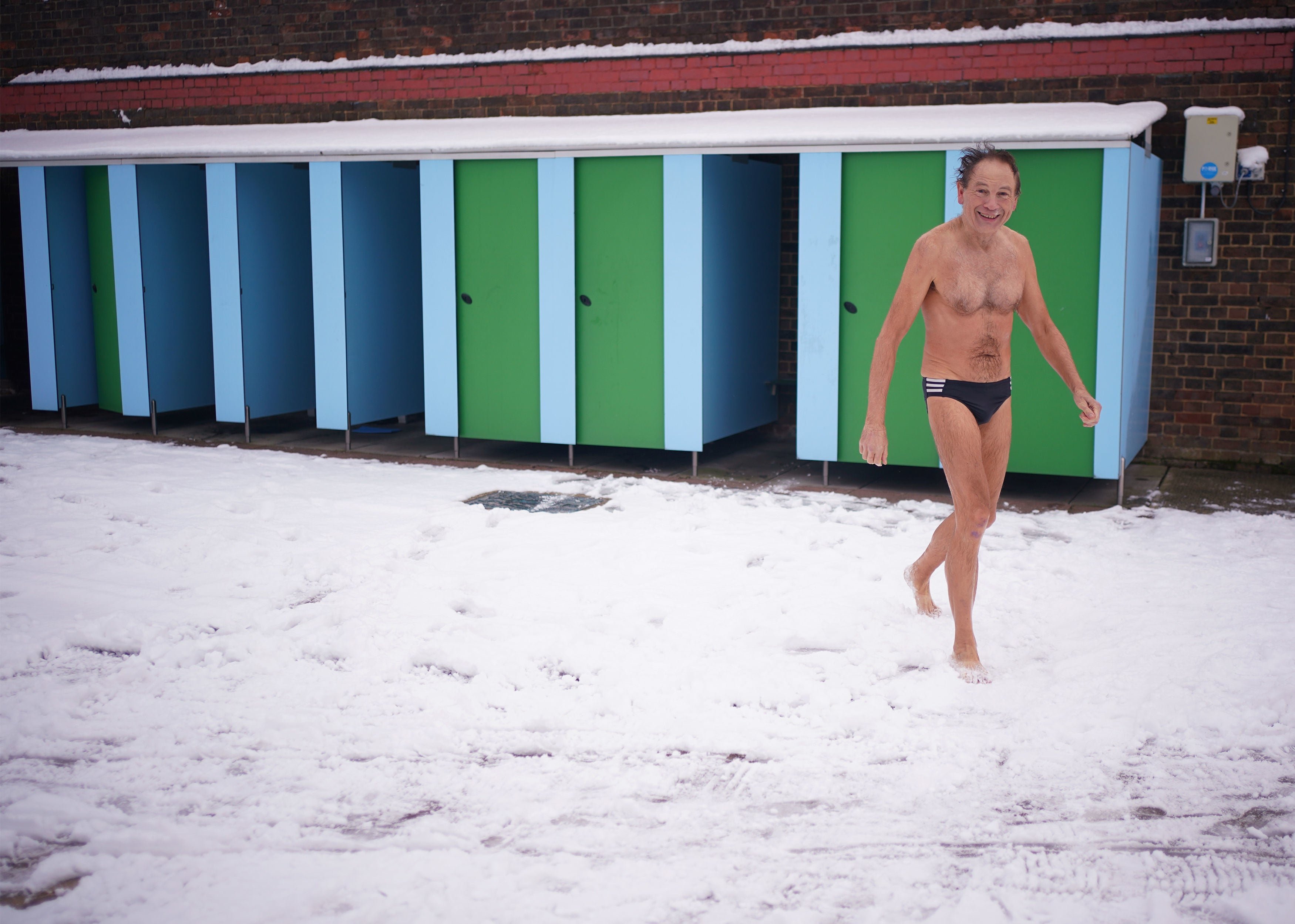 Early morning swimmers at Charlton Lido in Hornfair Park, London after last week’s snowfall