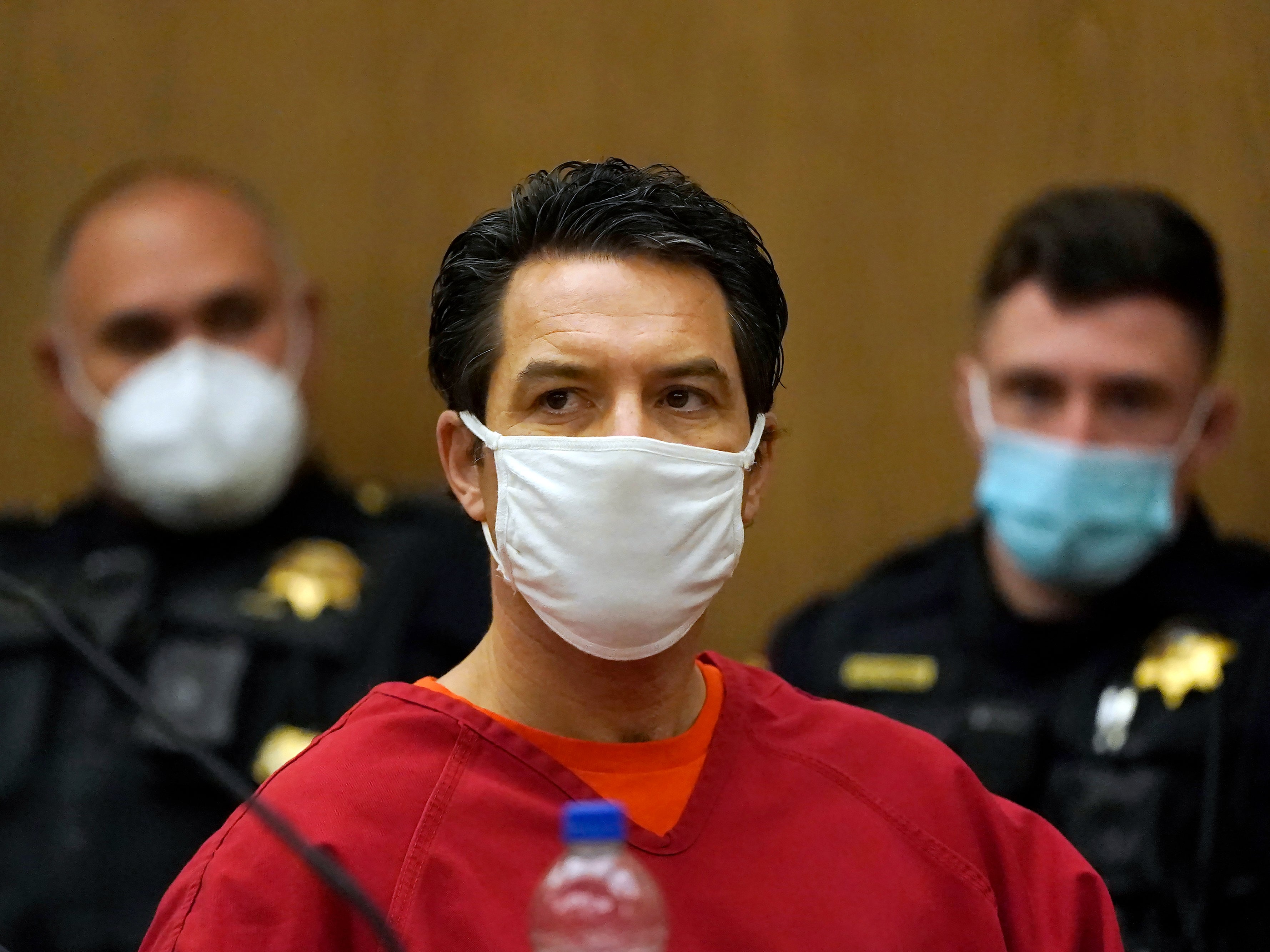 Scott Peterson listens during a a hearing to determine whether he gets a new trial for the 2002 murder of his pregnant wife