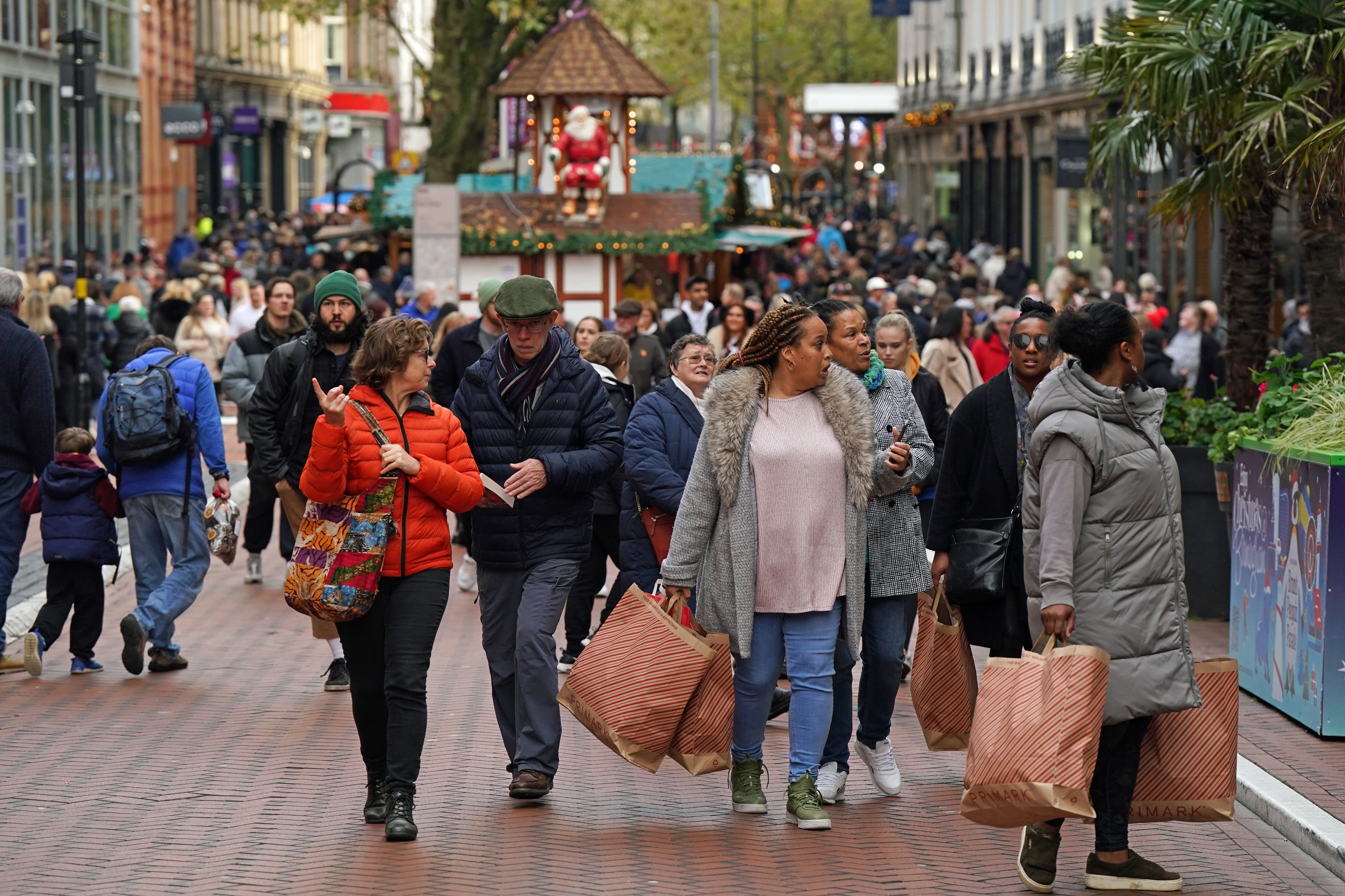 The FTSE 100 enjoyed a boost as investors flocked to cash in on retail stocks ahead of the post-Christmas sales (Jacob King/ PA)