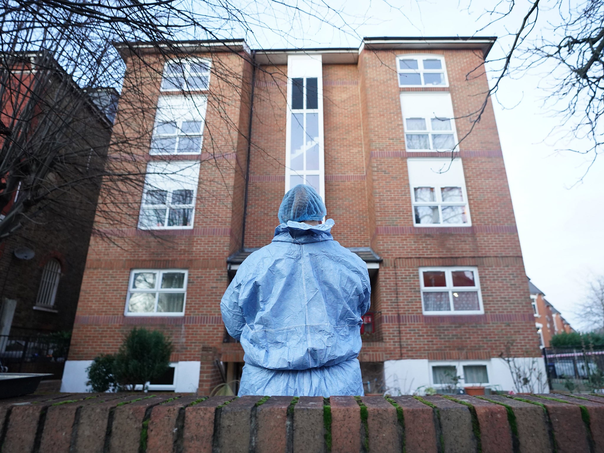 A forensic officer outside Gable House in Kilburn