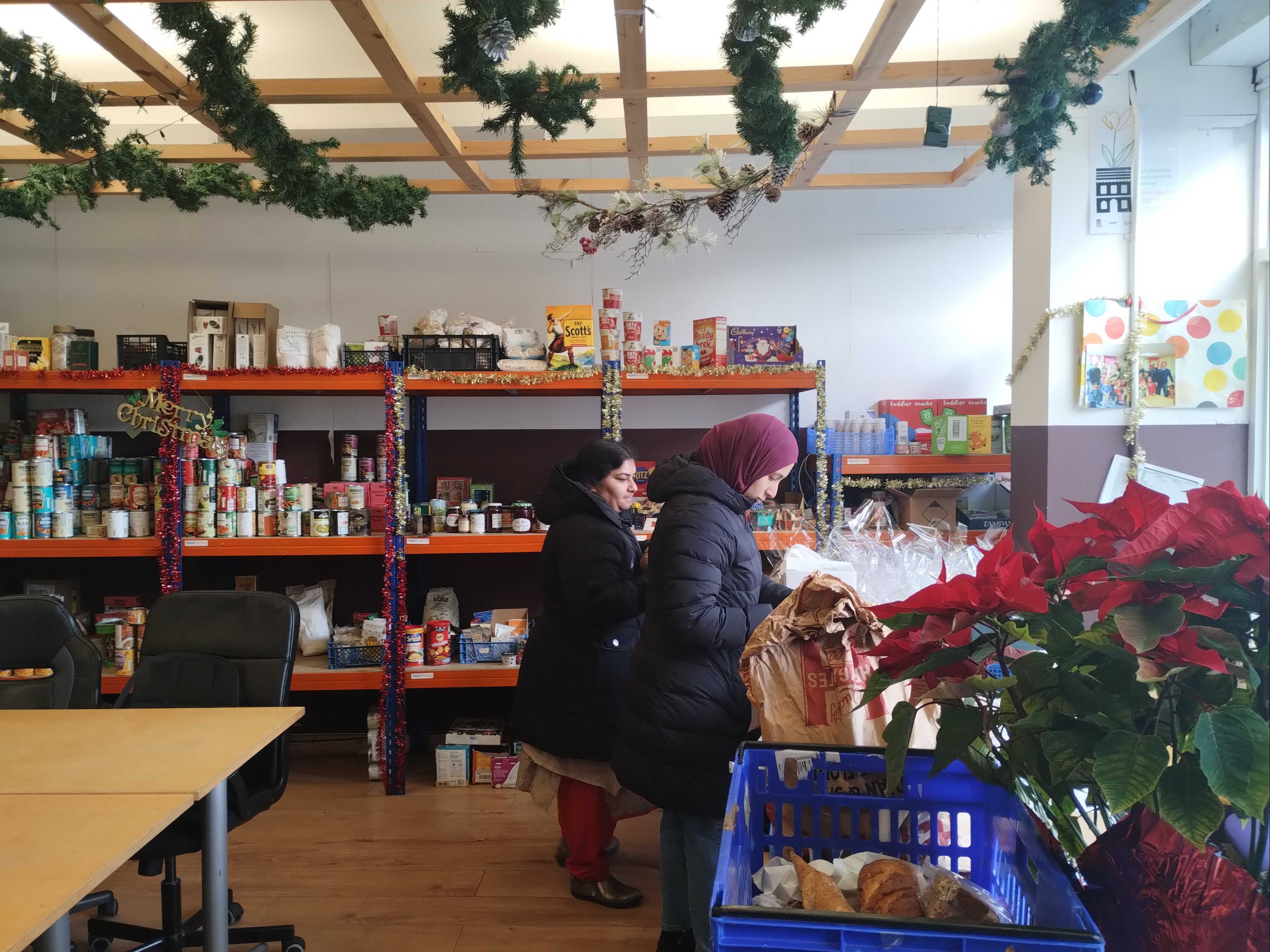 Families continue to get help at a food bank in west London as Christmas approaches