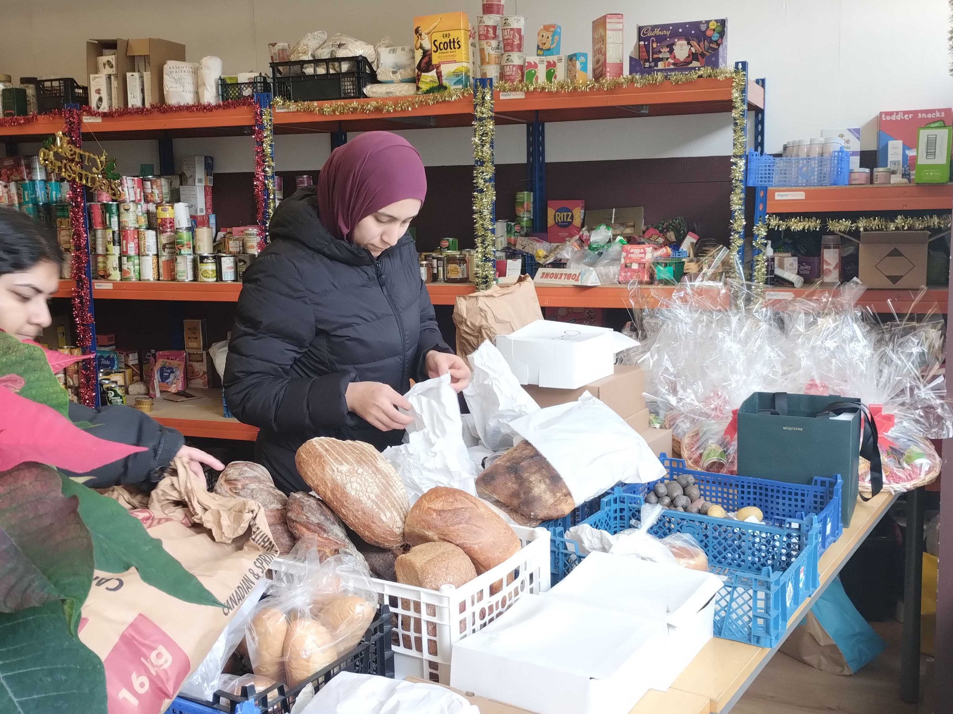 Volunteers help to pack food at Dad’s House in west London