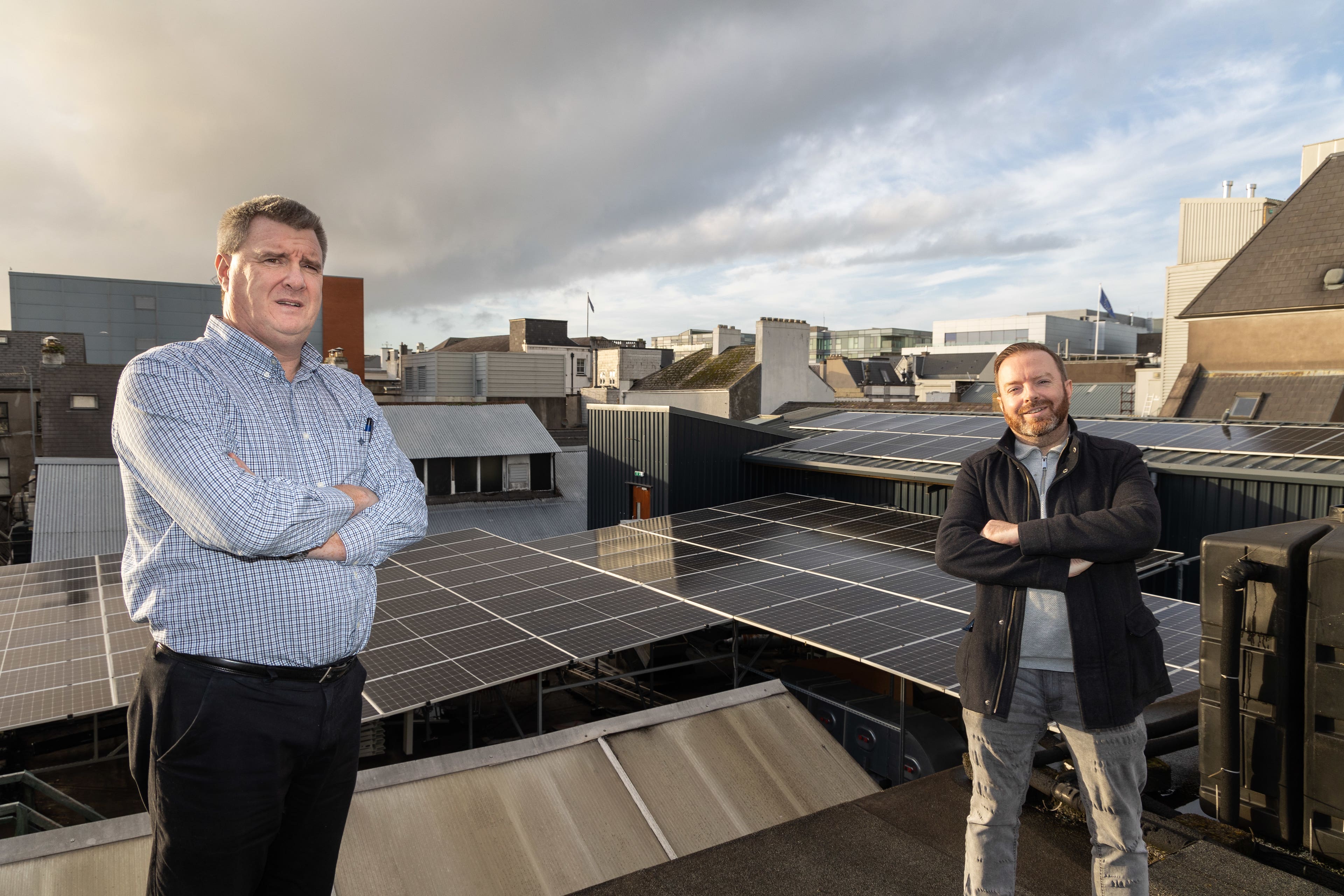 Kevin Cottrell (left) and Eoin Aher, with the solar panes at The Old Oak, Cork (Darragh Kane/PA)