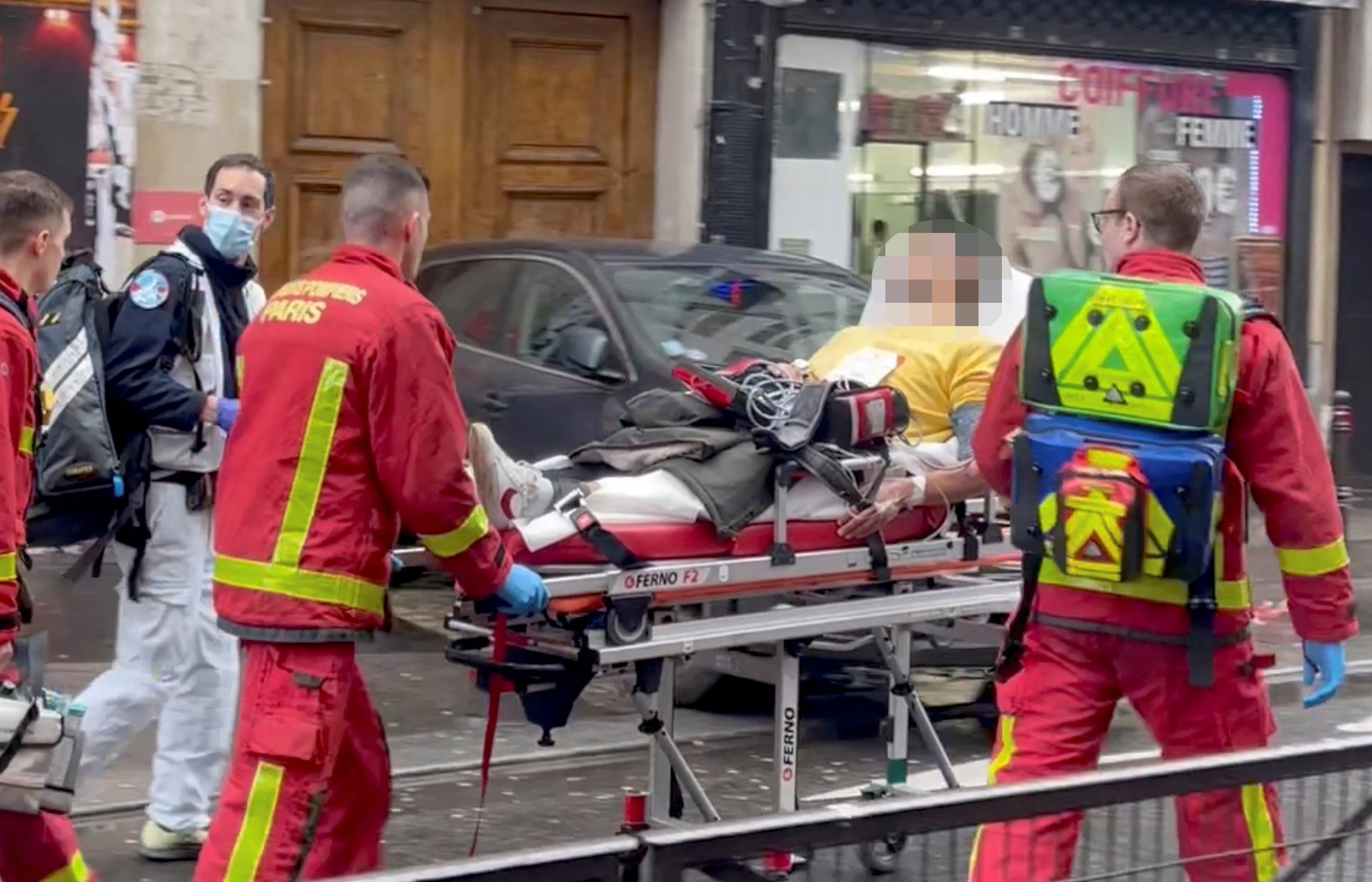 Firefighters move an injured man