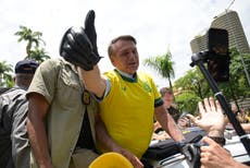 Photo of Bolsonaro eating KFC in Florida after Brazil election loss inspires memes – and even an oil painting