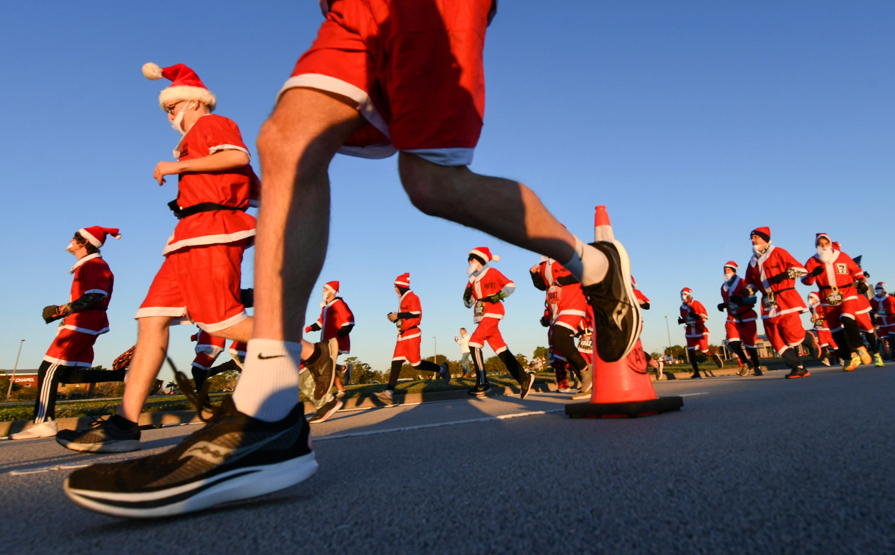 More than 800 runners dressed as Santa Claus braved near freezing temperatures to participate in the Run Run Santa 1 Mile Saturday Dec. 24, 2022 in Viera, Fla