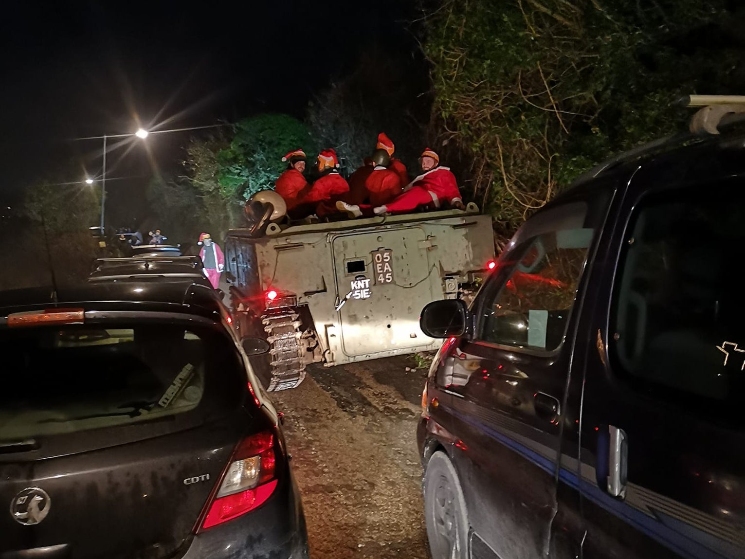 Ho ho... help: The group of Santas somewhat submerged in a hedge near Hayle