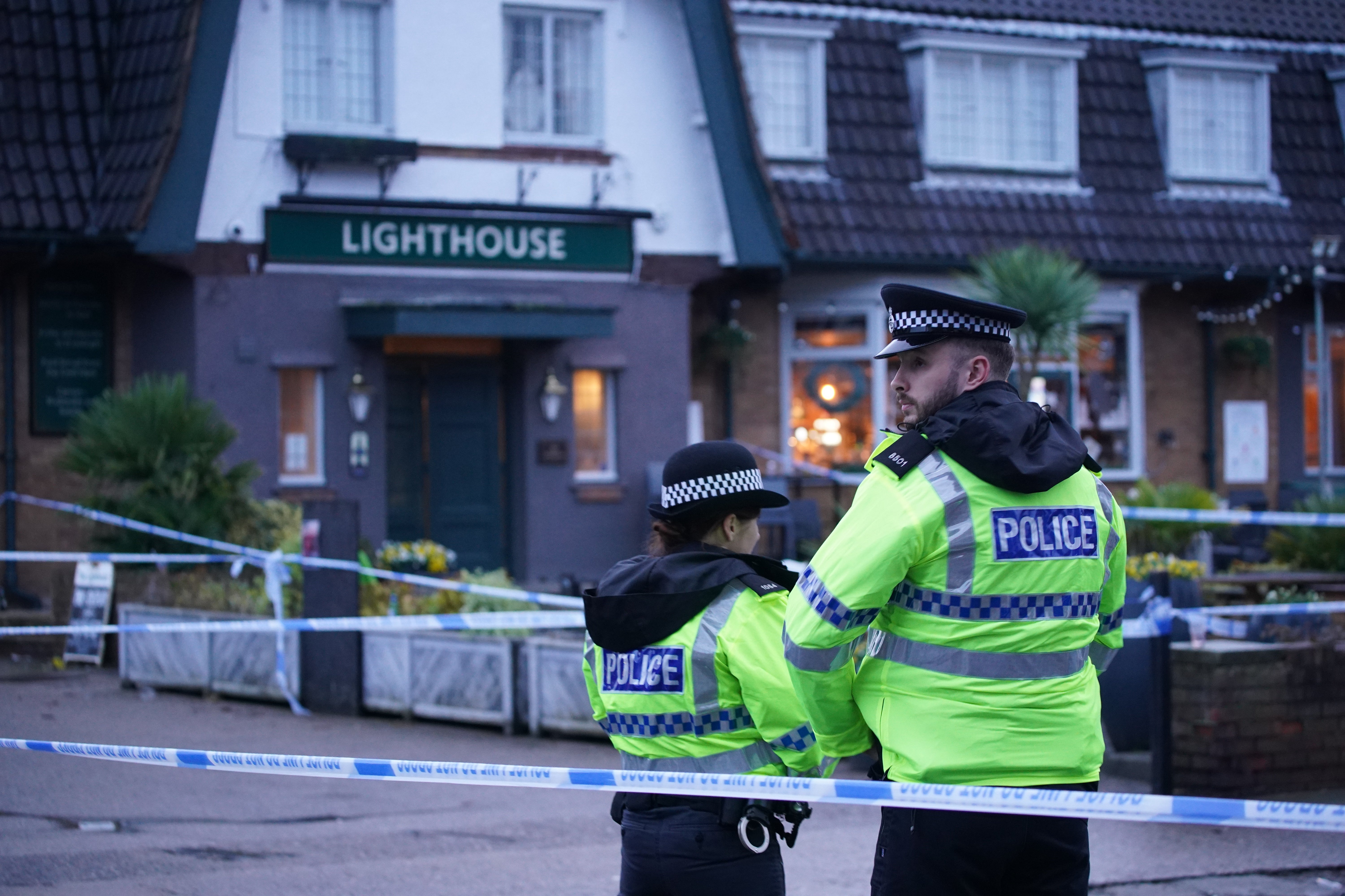 Police officers on duty at the Lighthouse Inn in Wallasey Village, near Liverpool