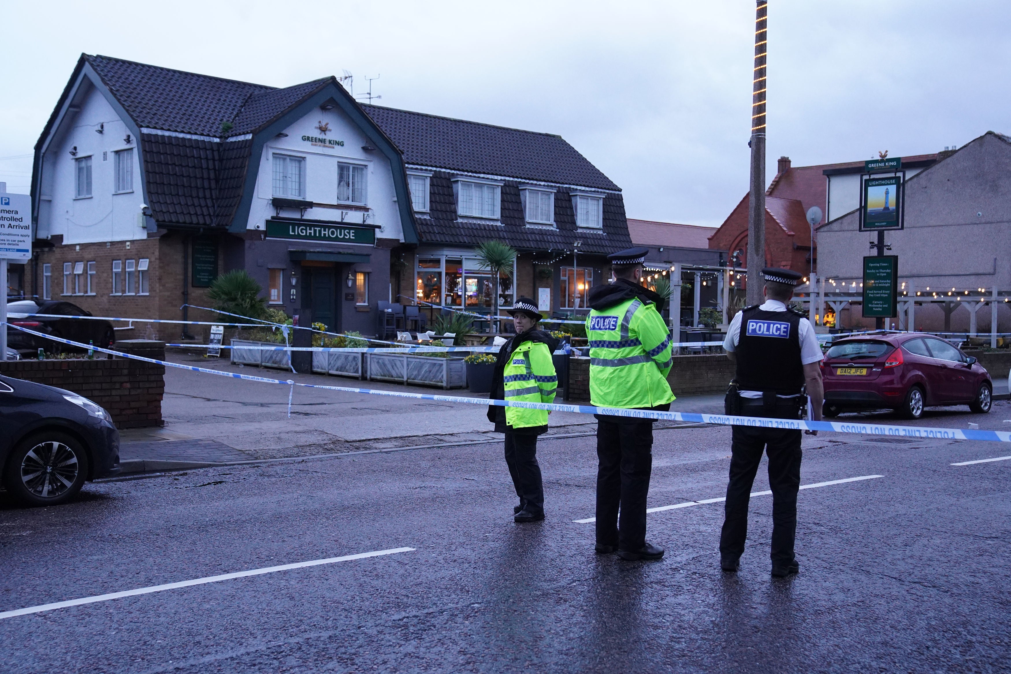 Police officers at the Lighthouse Inn in Wallasey Village