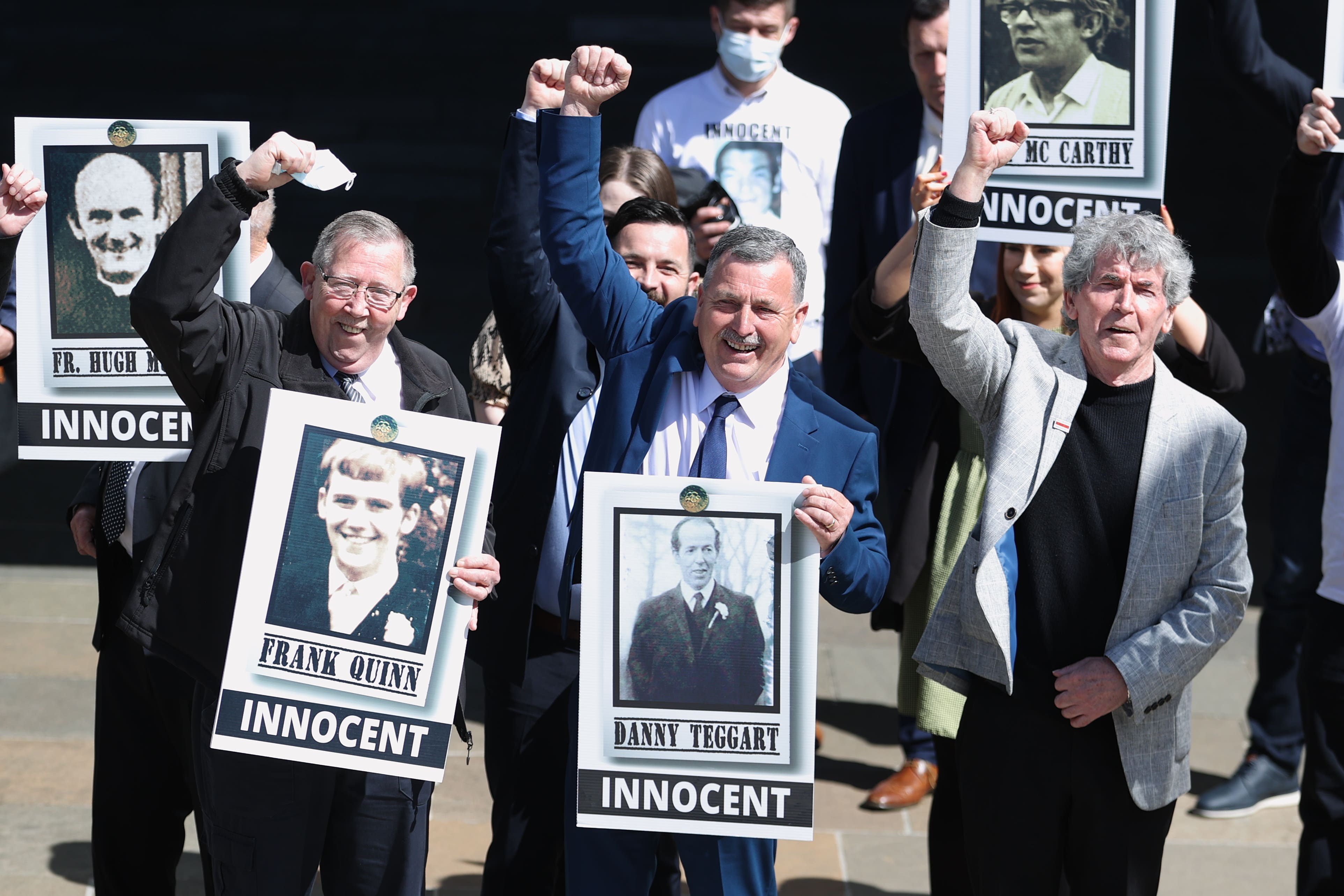 Families celebrate outside Belfast Coroner’s Court in 2021 after a fresh inquest into the shooting of 10 people at Ballymurphy in 1971 found they were all innocent victims (Liam McBurney/PA)