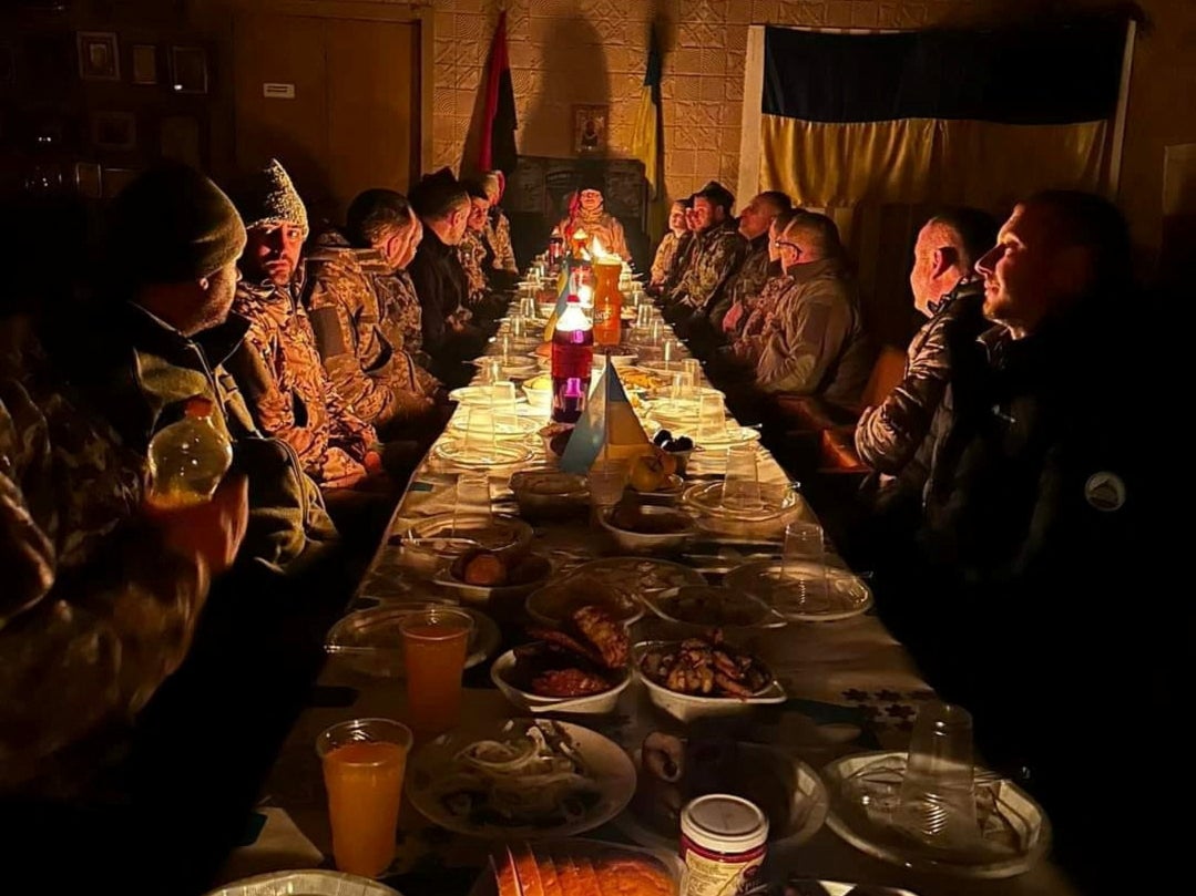 Ukrainian service members have Christmas dinner at an unknown location in Ukraine