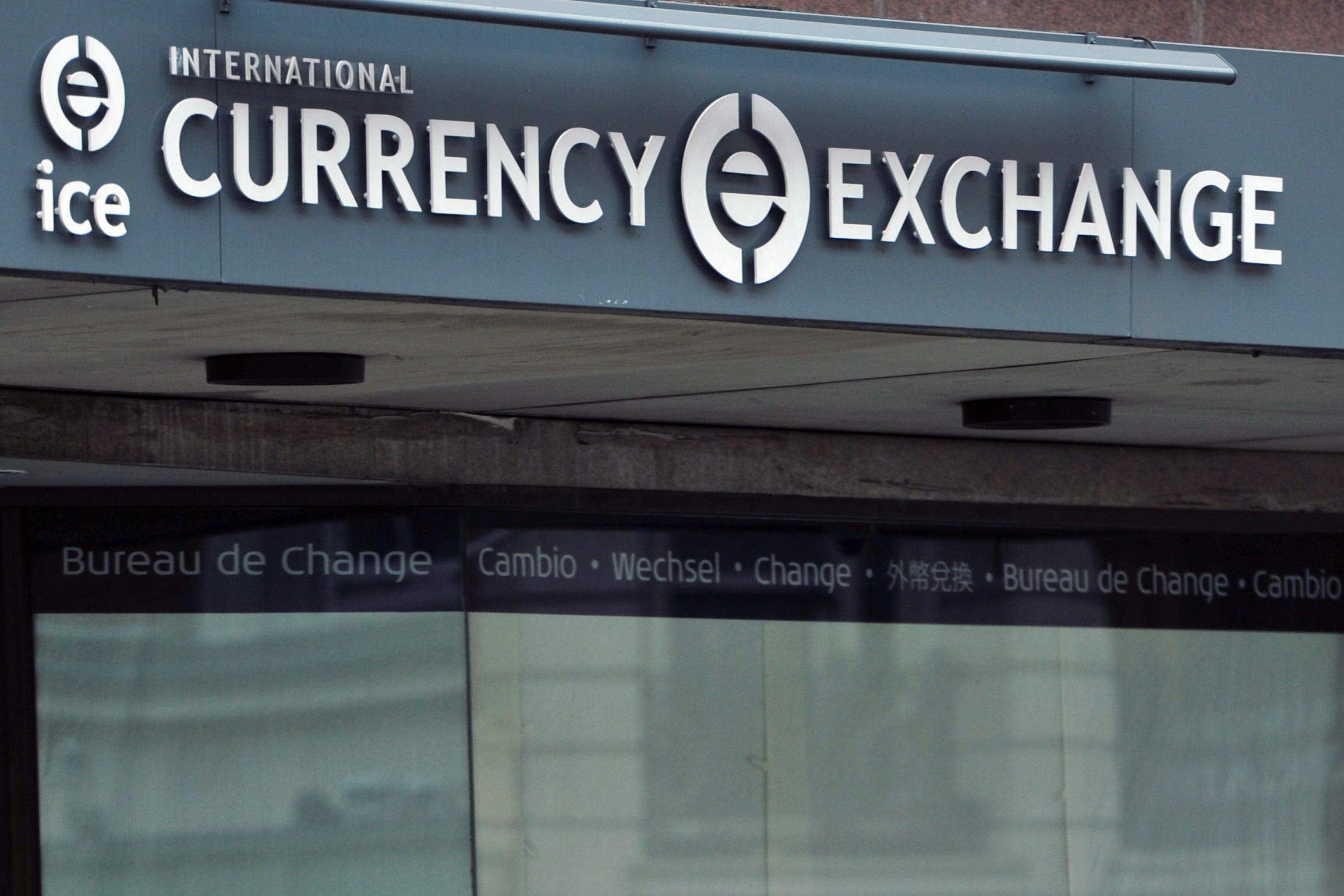 A homeless man sleeps outside a currency exchange (Anthony Devlin/PA)