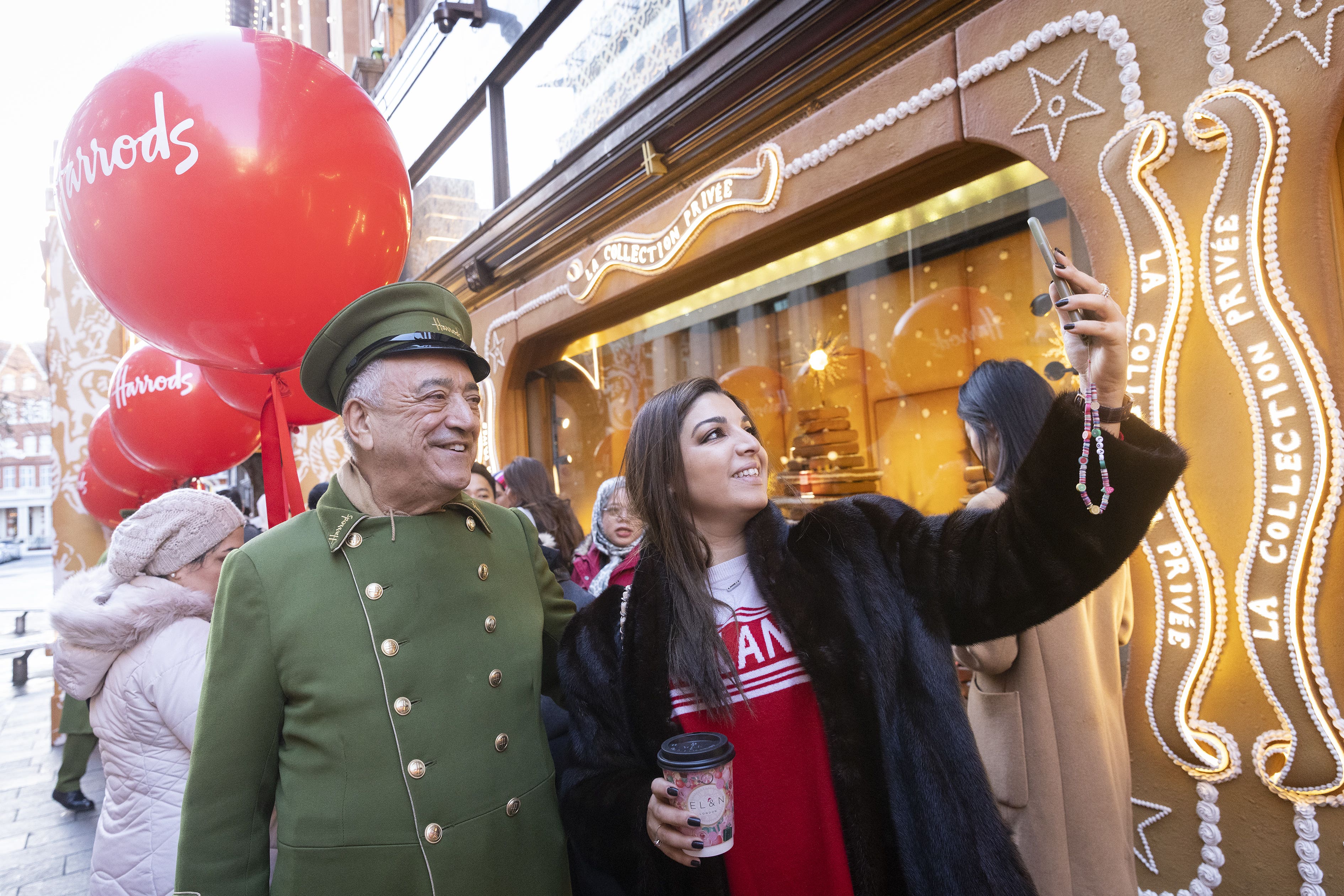 Michael Pinsker greeting Zineb Elateq queuing outside Harrods in Knightsbridge (Matt Alexander/PA)