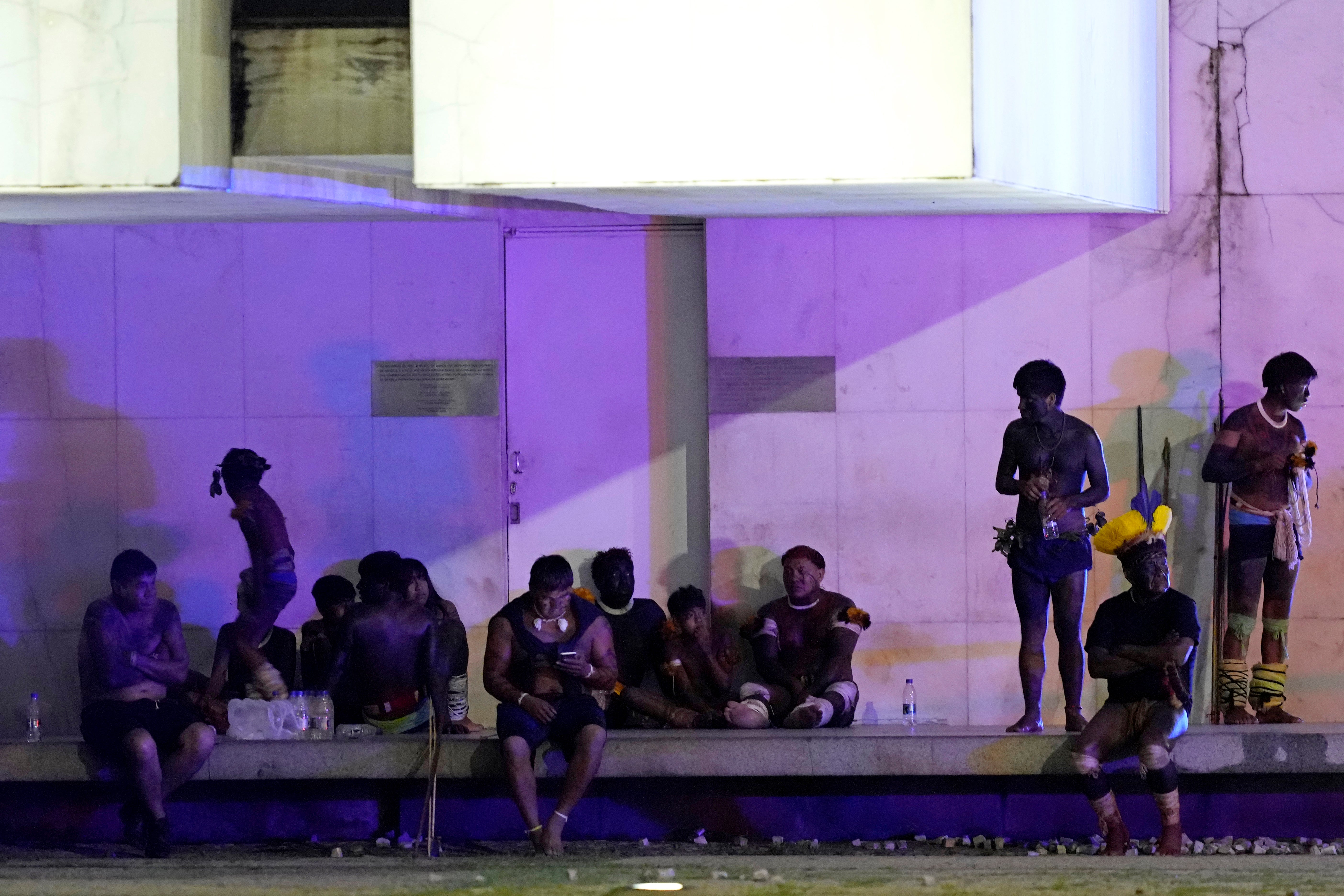 Indigenous supporters of outgoing Jair Bolsonaro gather after an attempted invasion of the Supreme Court building in Brasilia on Sunday