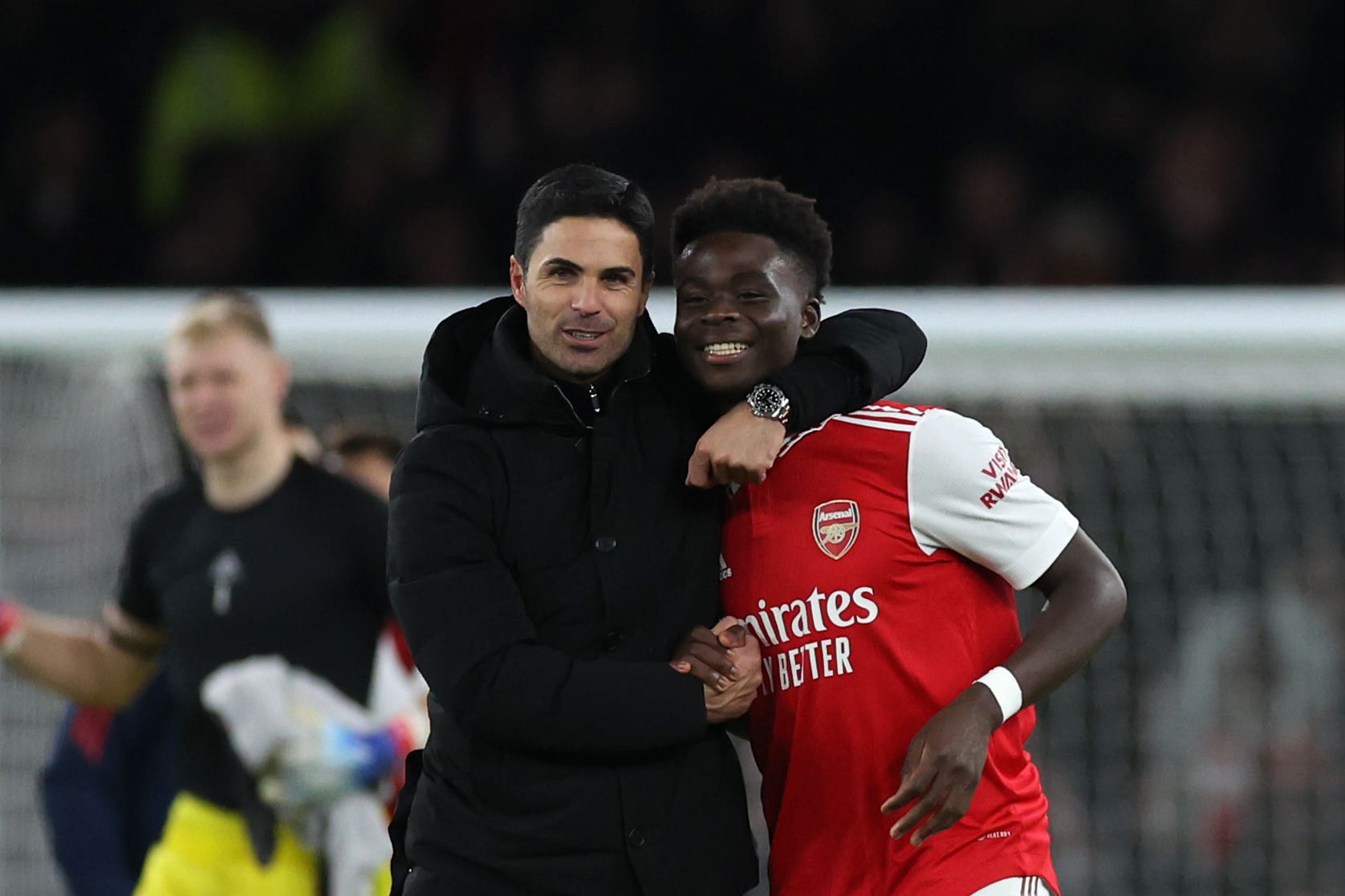 Arsenal manager Mikel Arteta, left, celebrates with Bukayo Saka (Steven Paston/PA)