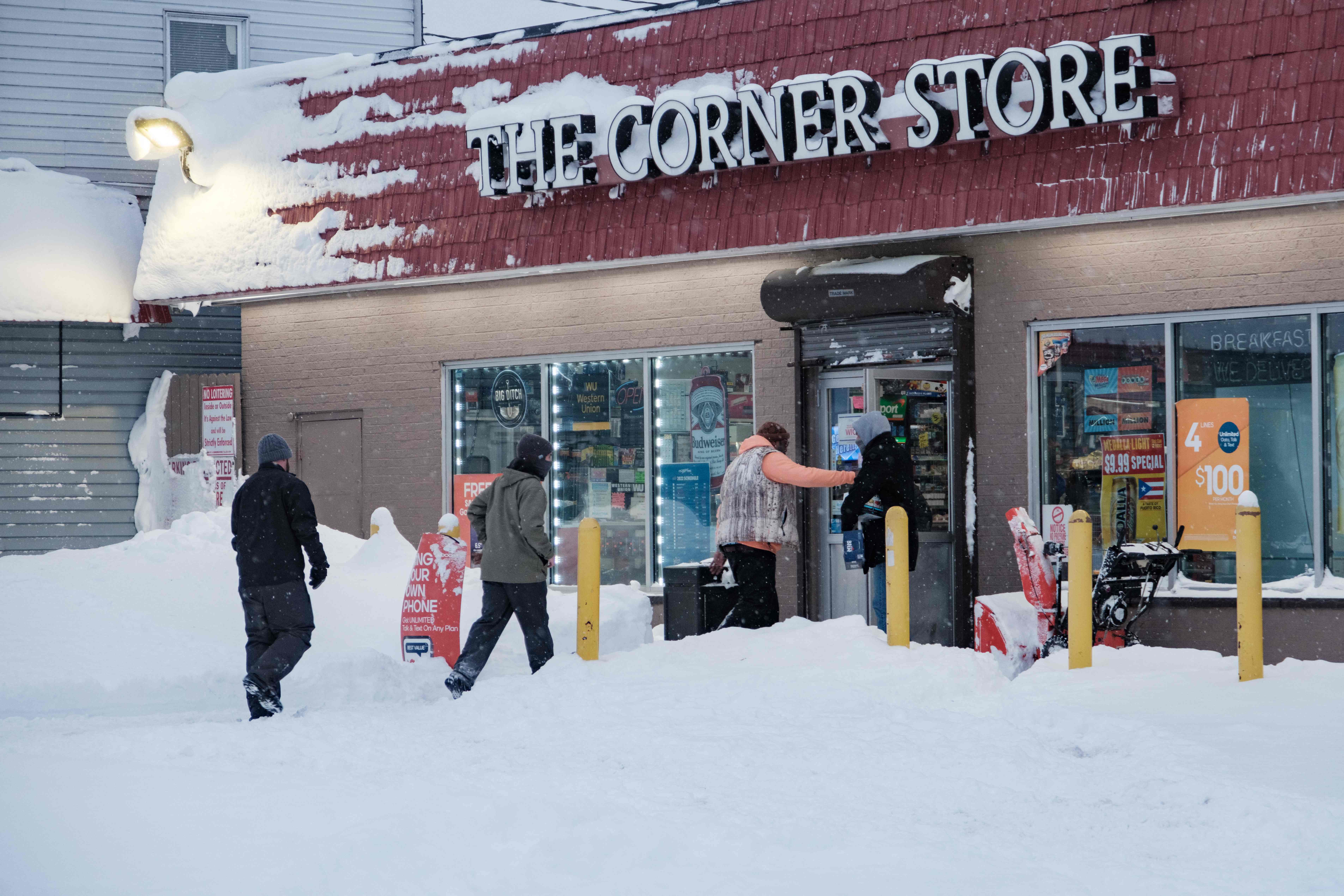 Residents enter a local corner store in Buffalo, New York