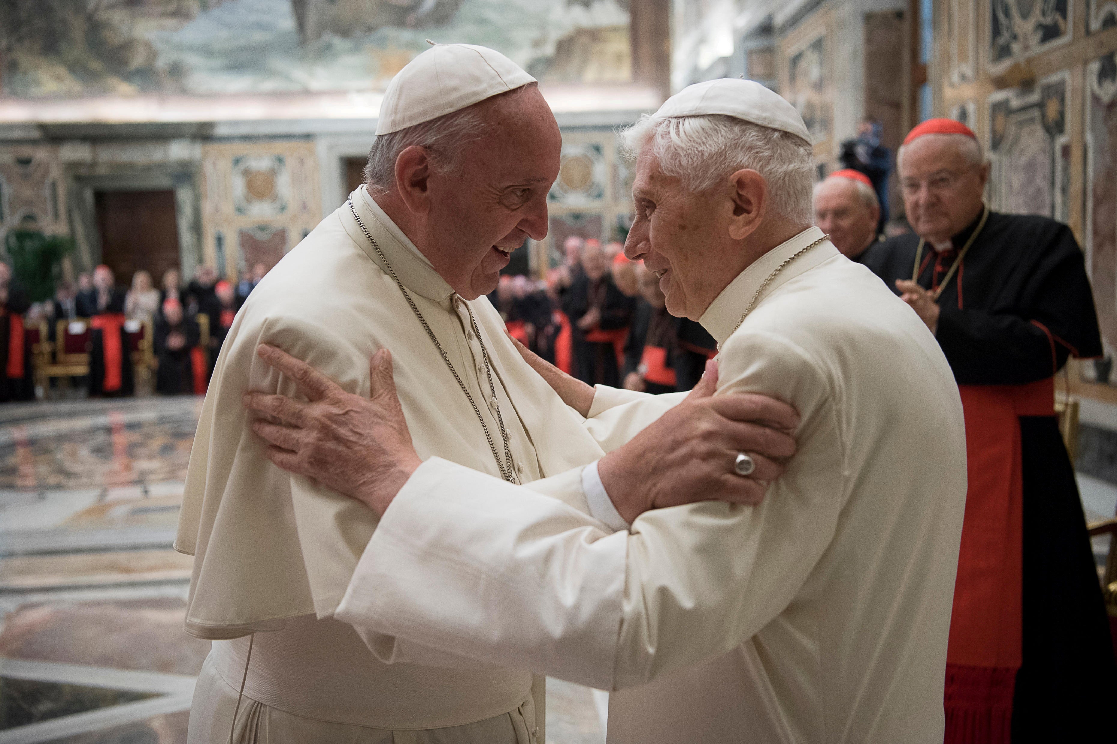 Former pope Benedict, right, is greeted by Pope Francis during a ceremony in 2016