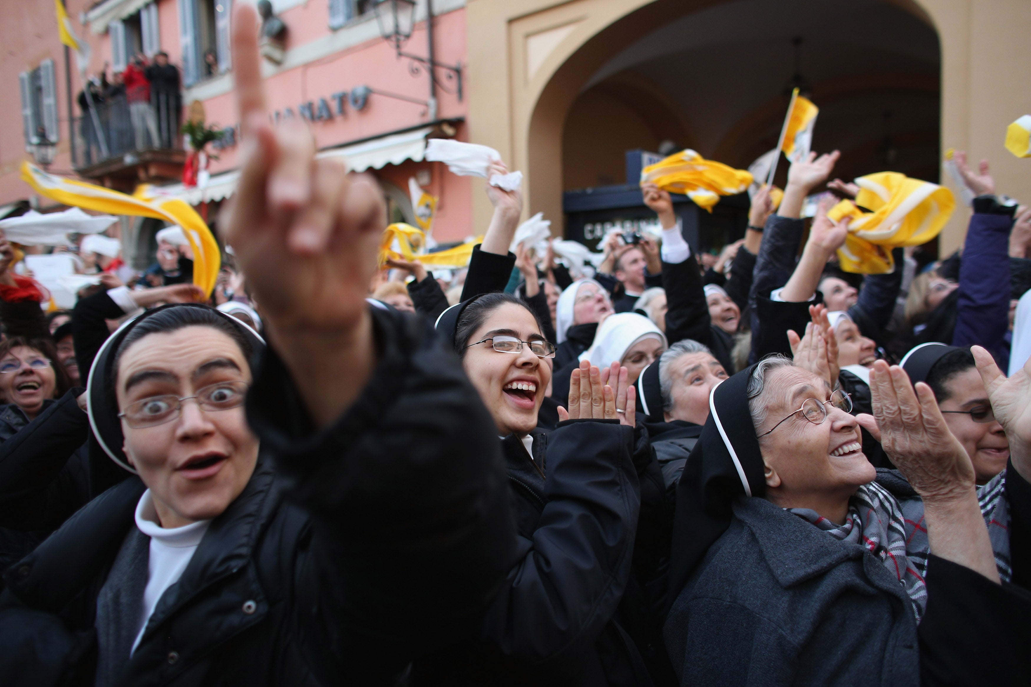 Nuns cheer as Benedict waves to pilgrims for the last time as head of the Catholic Church on 28 February 2013