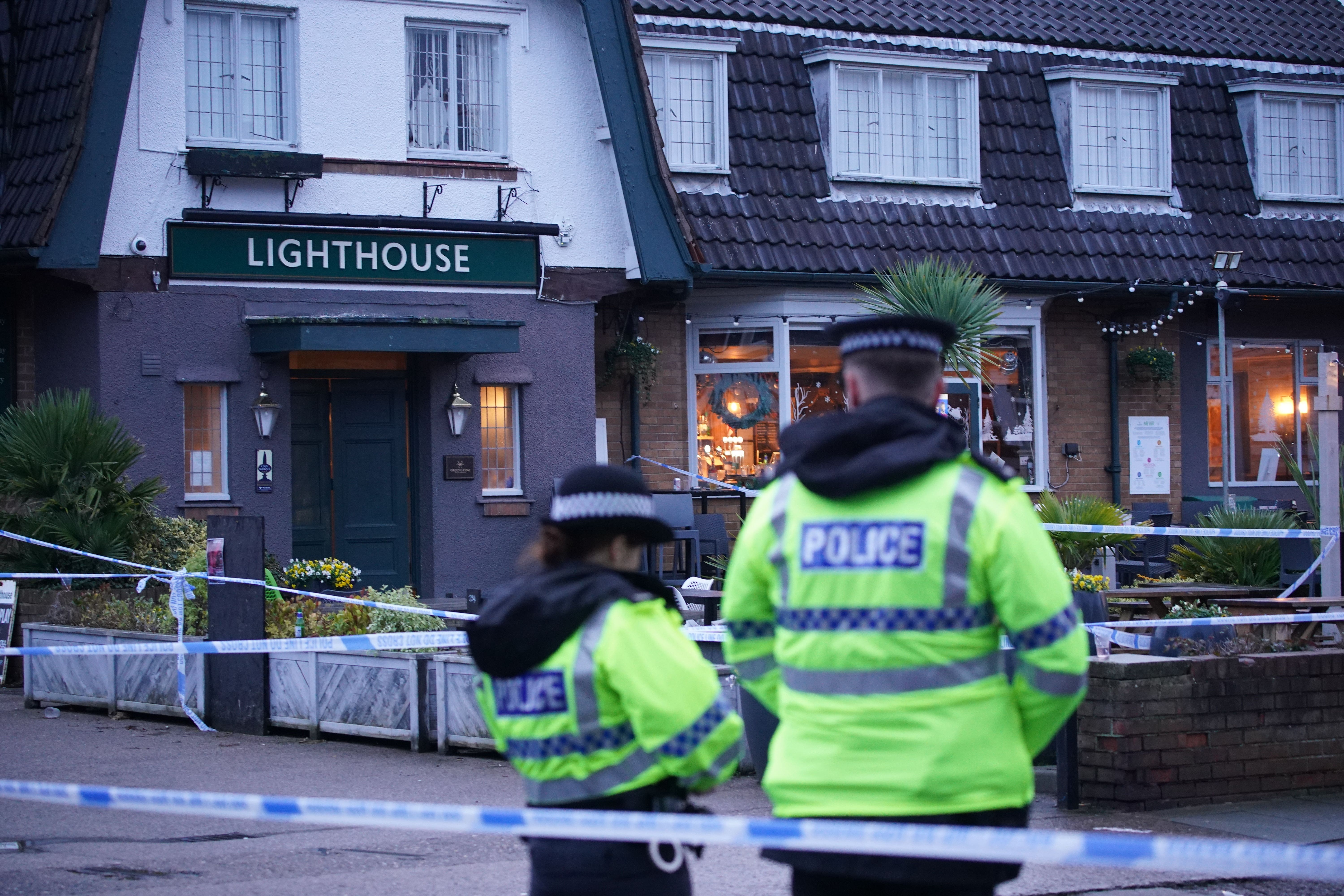 Police officers on duty at the Lighthouse Inn in Wallasey Village, Wirral, where the shooting occurred