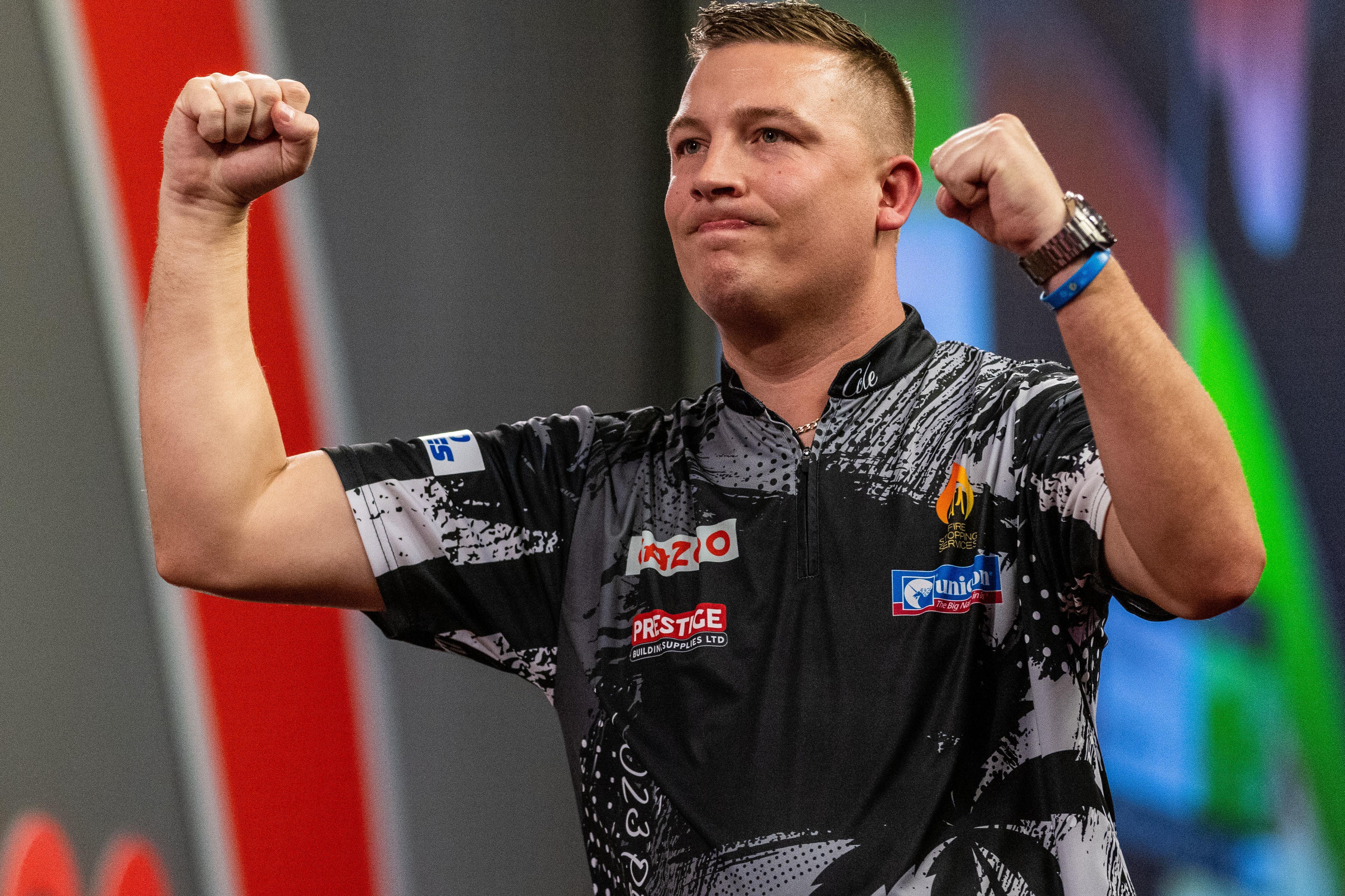 Chris Dobey, pictured, battled back to beat two-time champion Gary Anderson (Steven Paston/PA)