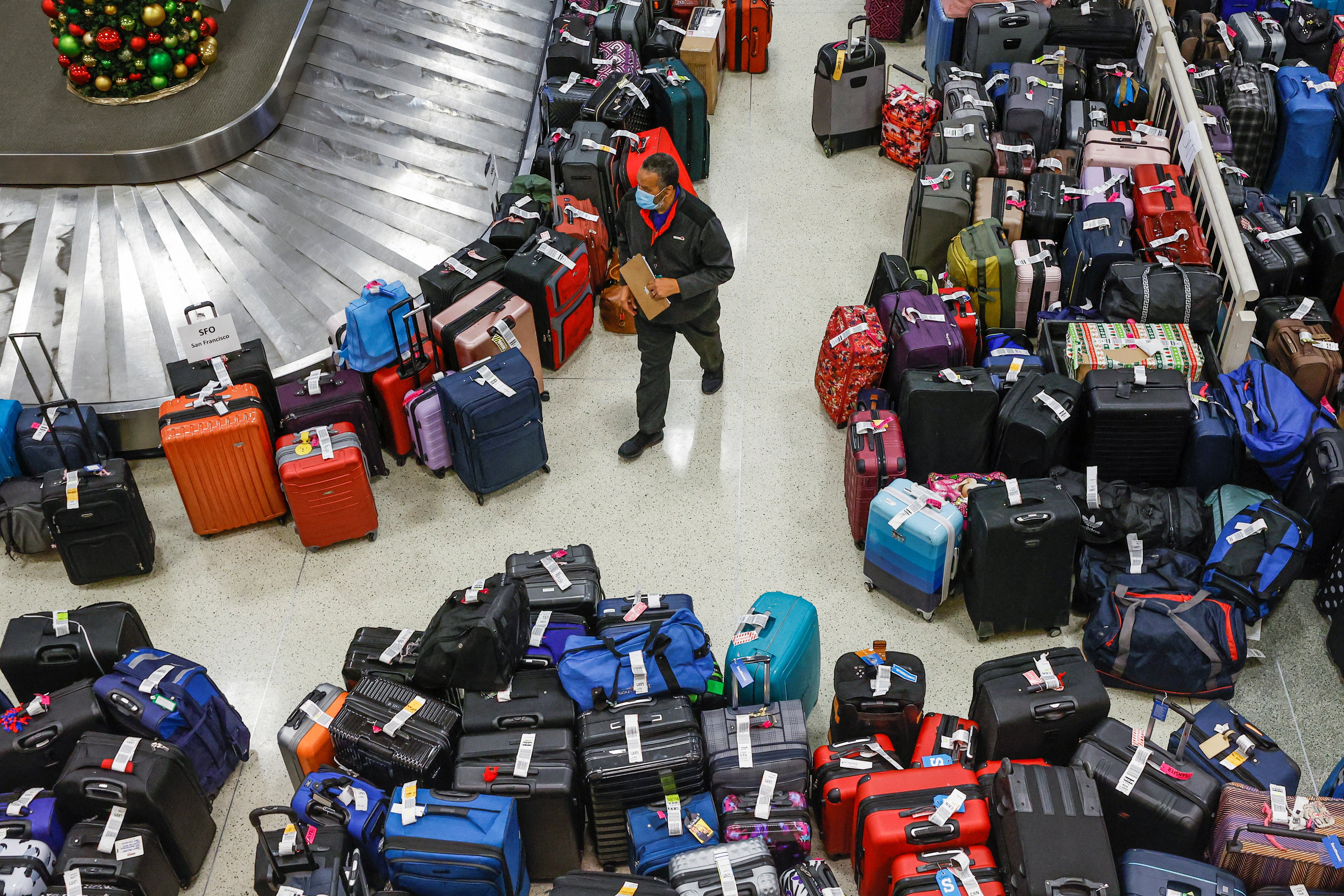 Mountains of bags are seen at Chicago Midway International Airport after flight cancellations