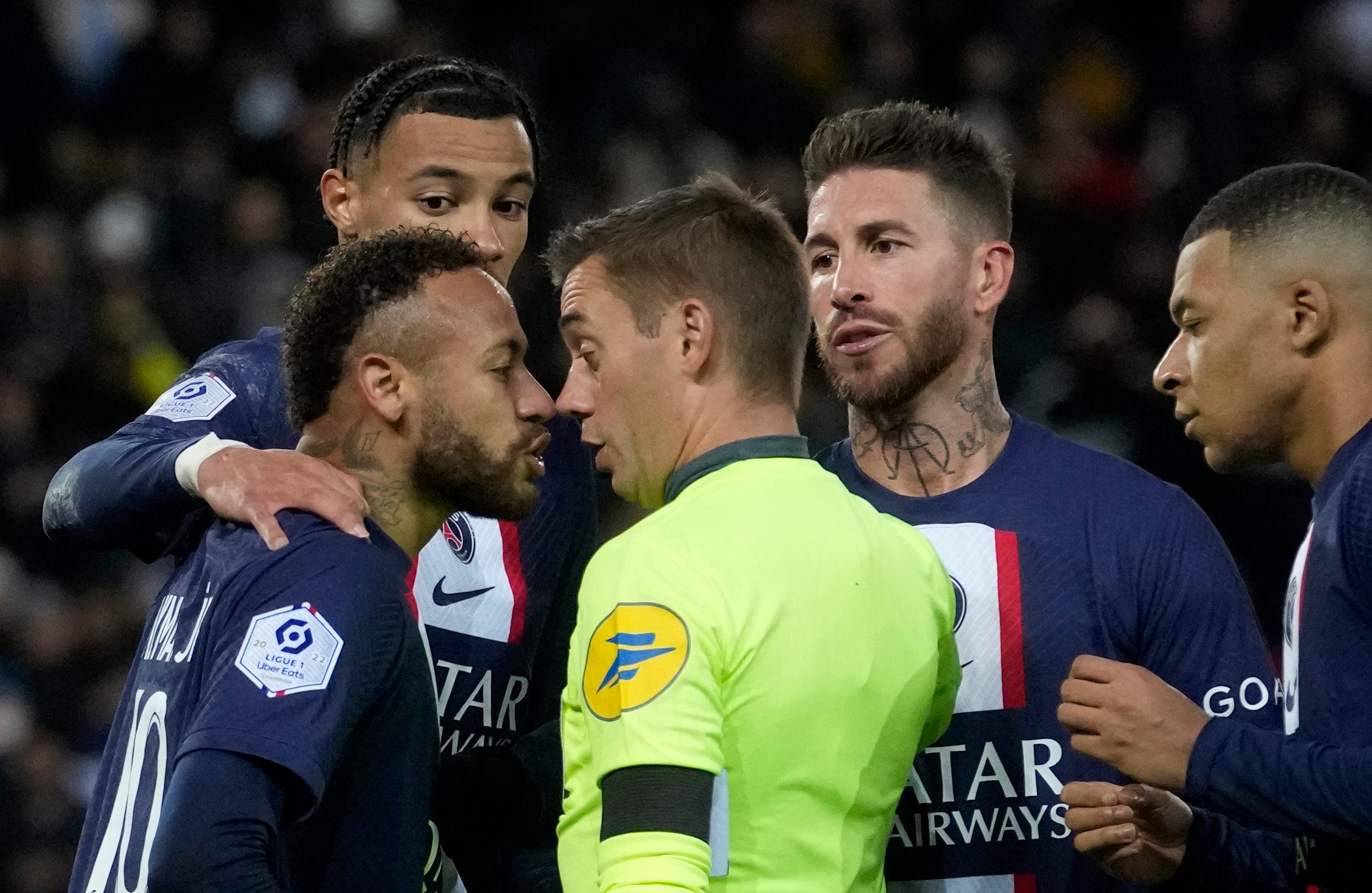 Neymar confronts referee Clement Turpin after being shown red