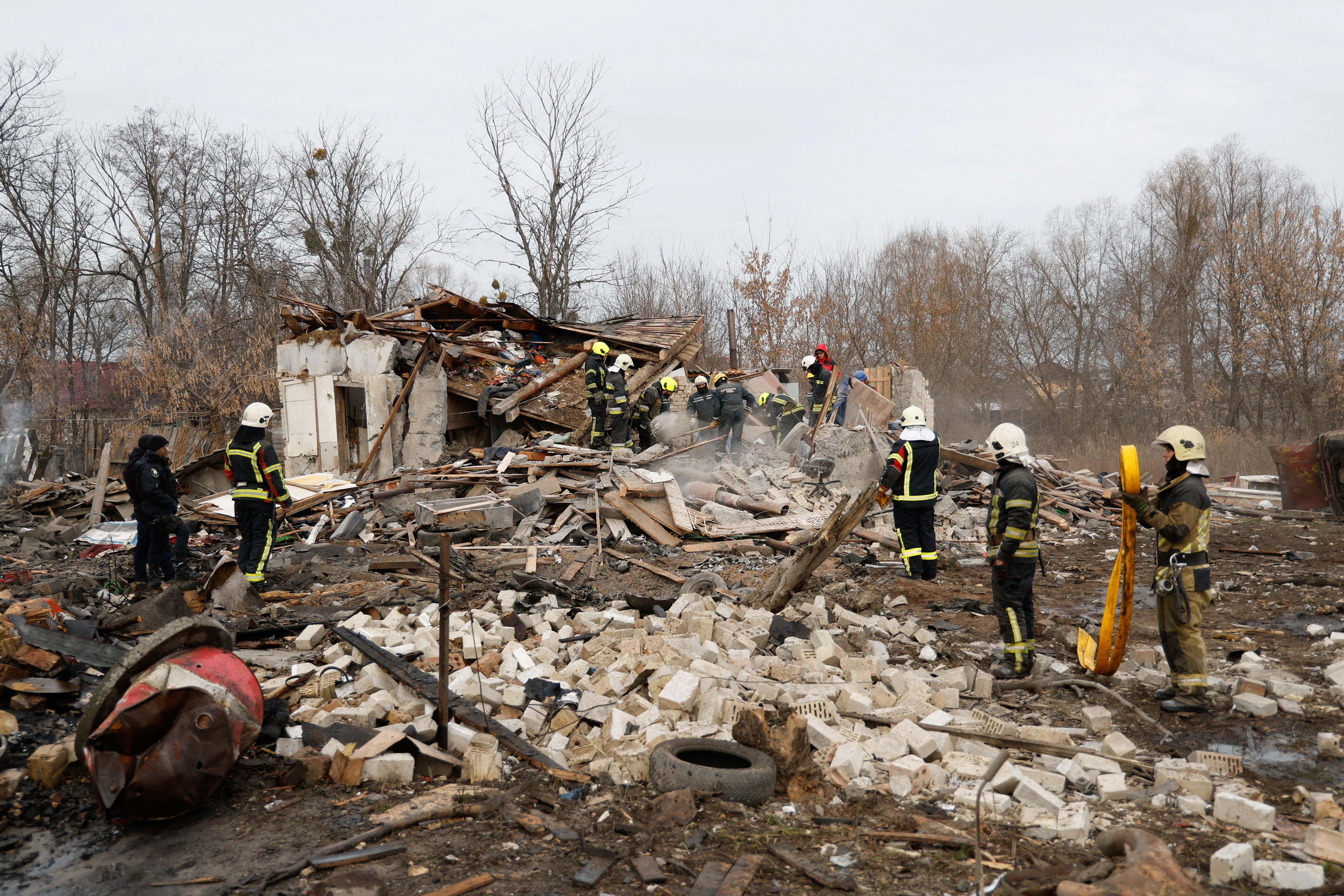 Ukraine rescuers search through ruins following a Russian air strike on Thursday