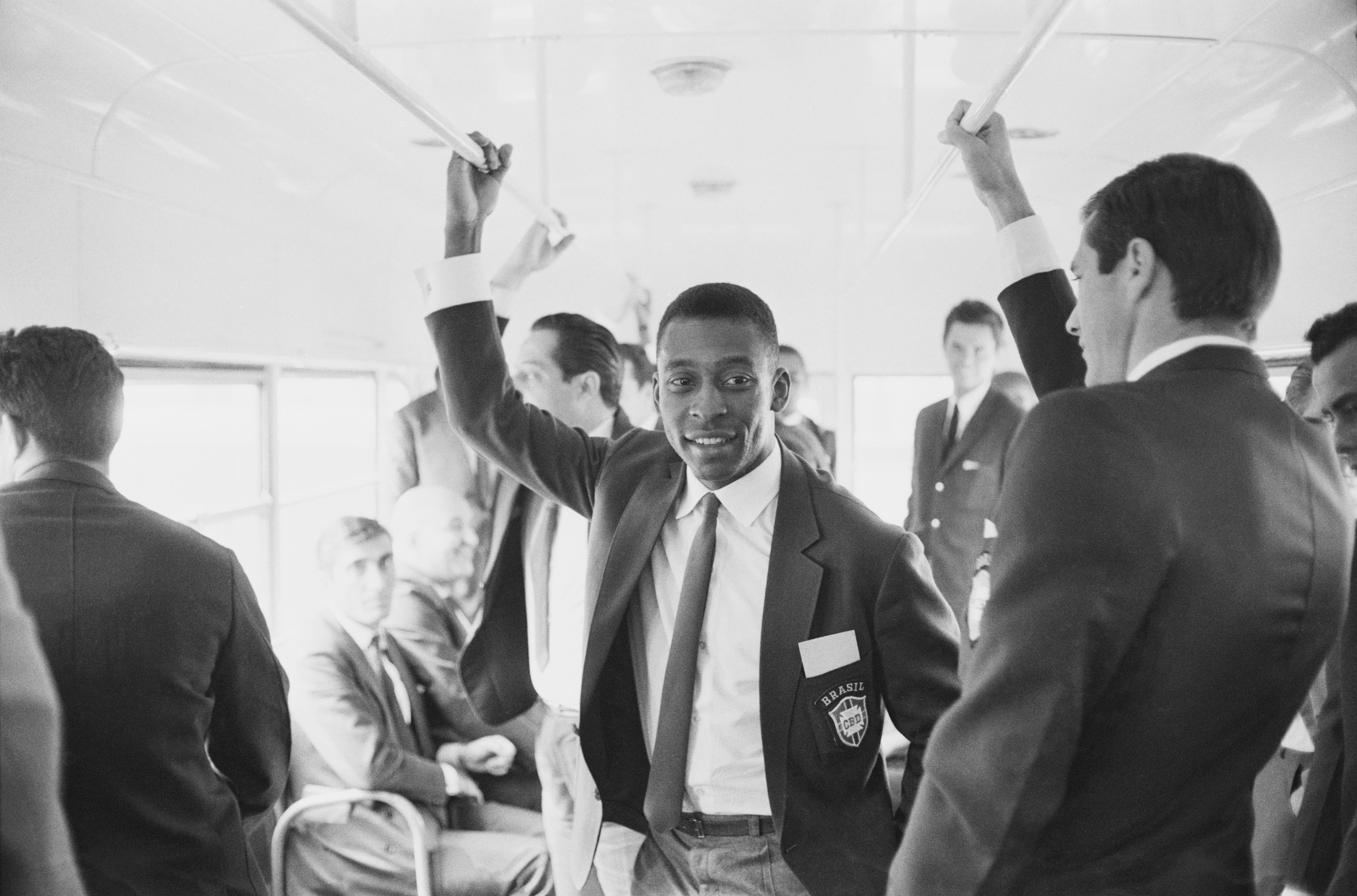 Pele with his teammates of Brazil national football team travelling on a bus upon their arrival in the UK for the 1966 Fifa World Cup, UK, 25th June 1966.