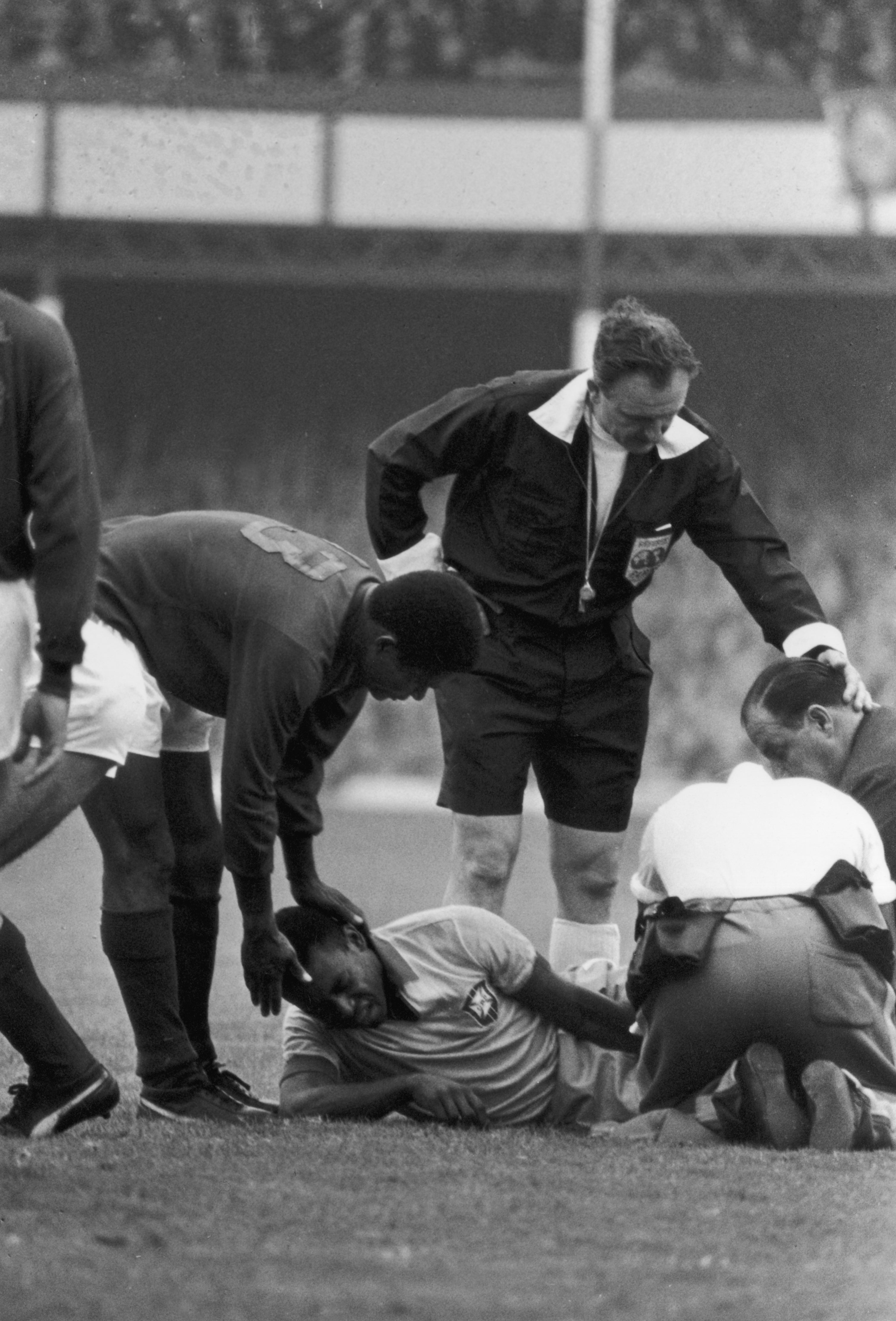 19th July 1966: Pele writhes in agony, having been injured in a tackle during the World Cup match against Portugal at Goodison Park, Liverpool.