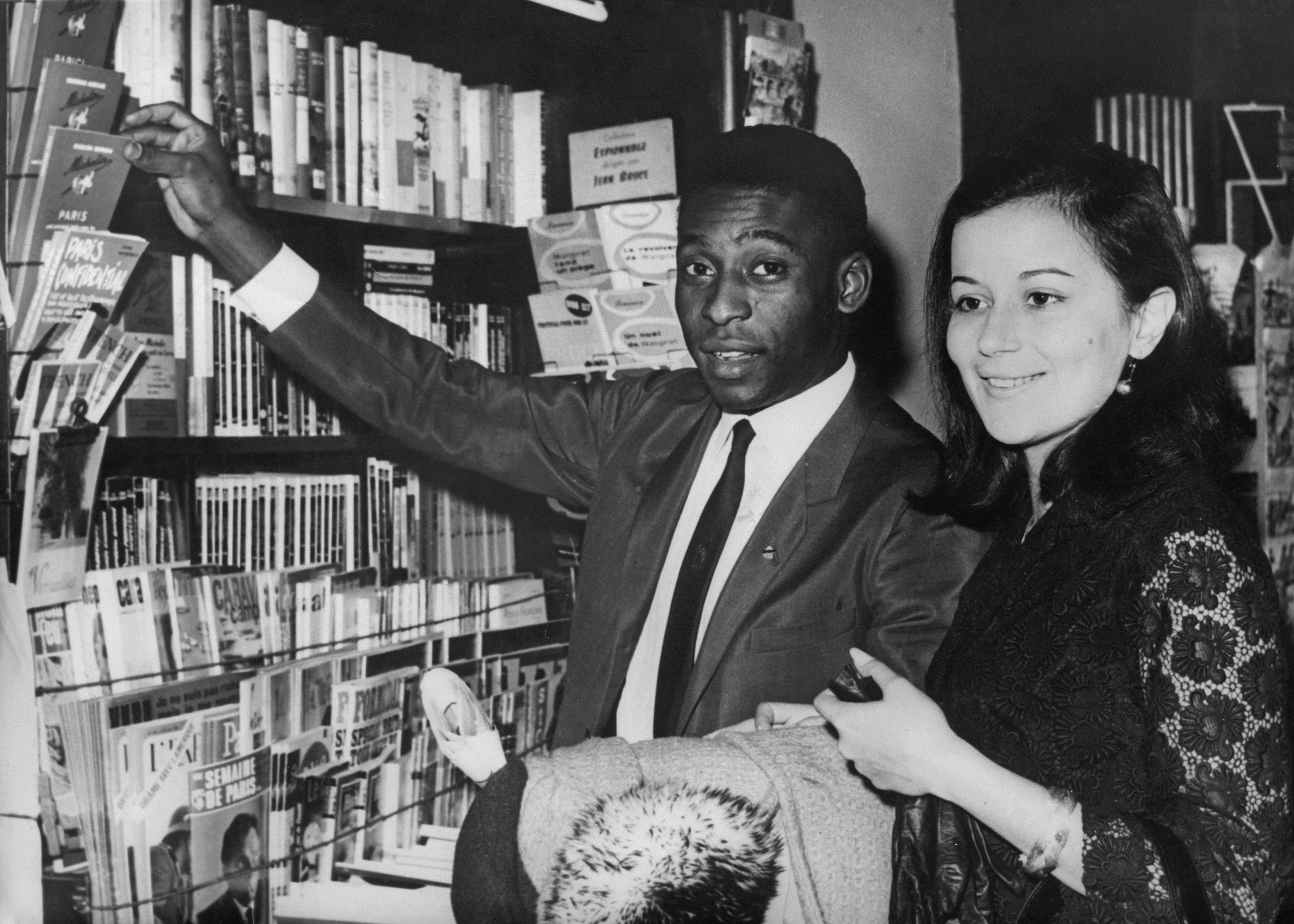 Pele and his wife Rosemeri dos Reis Cholbi shopping in Paris where they were honeymooning, 17th March 1966.