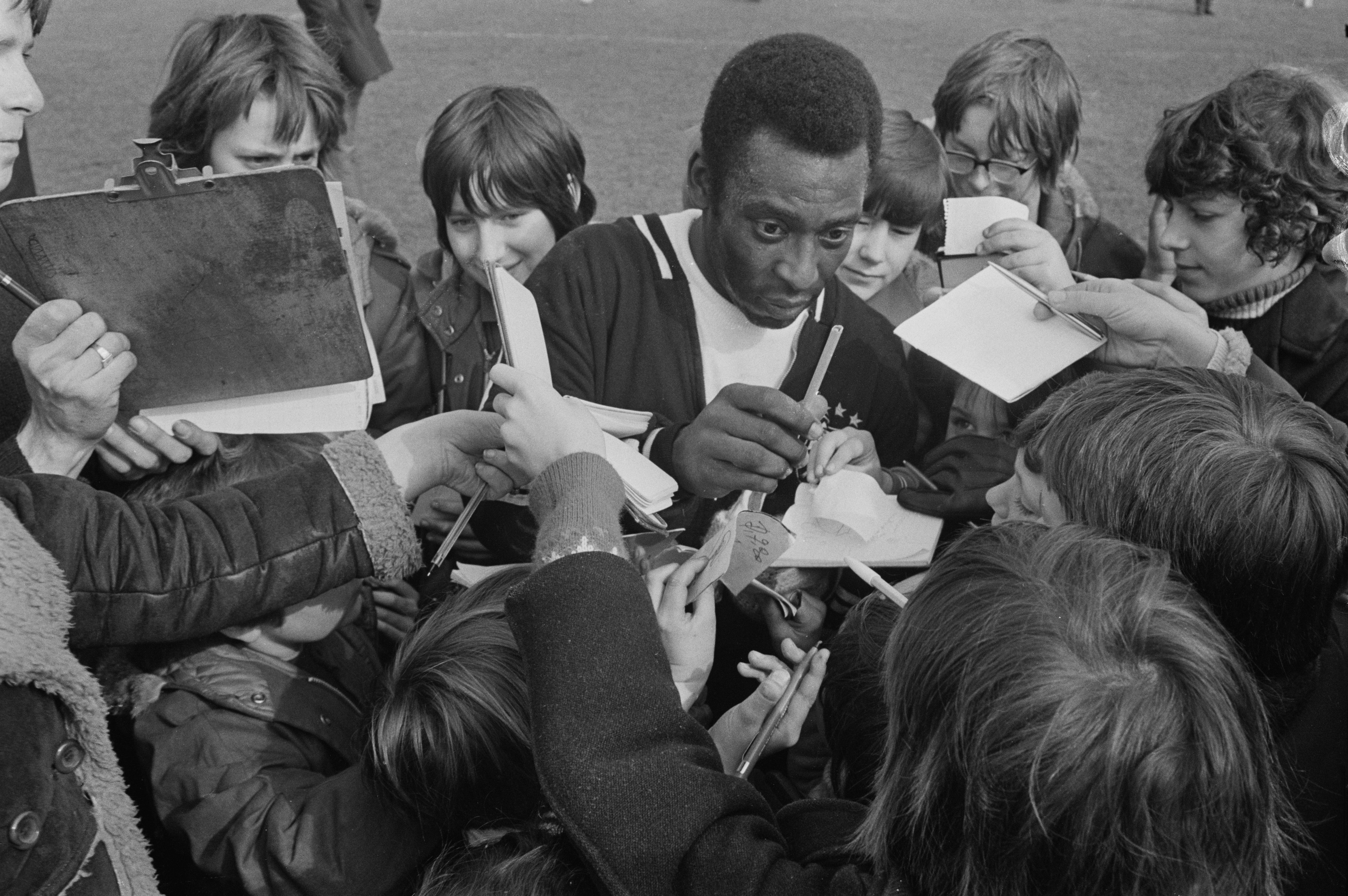 Pele meets young fans at Craven Cottage stadium, home ground of Fulham FC, London, UK, 12th March 1973.