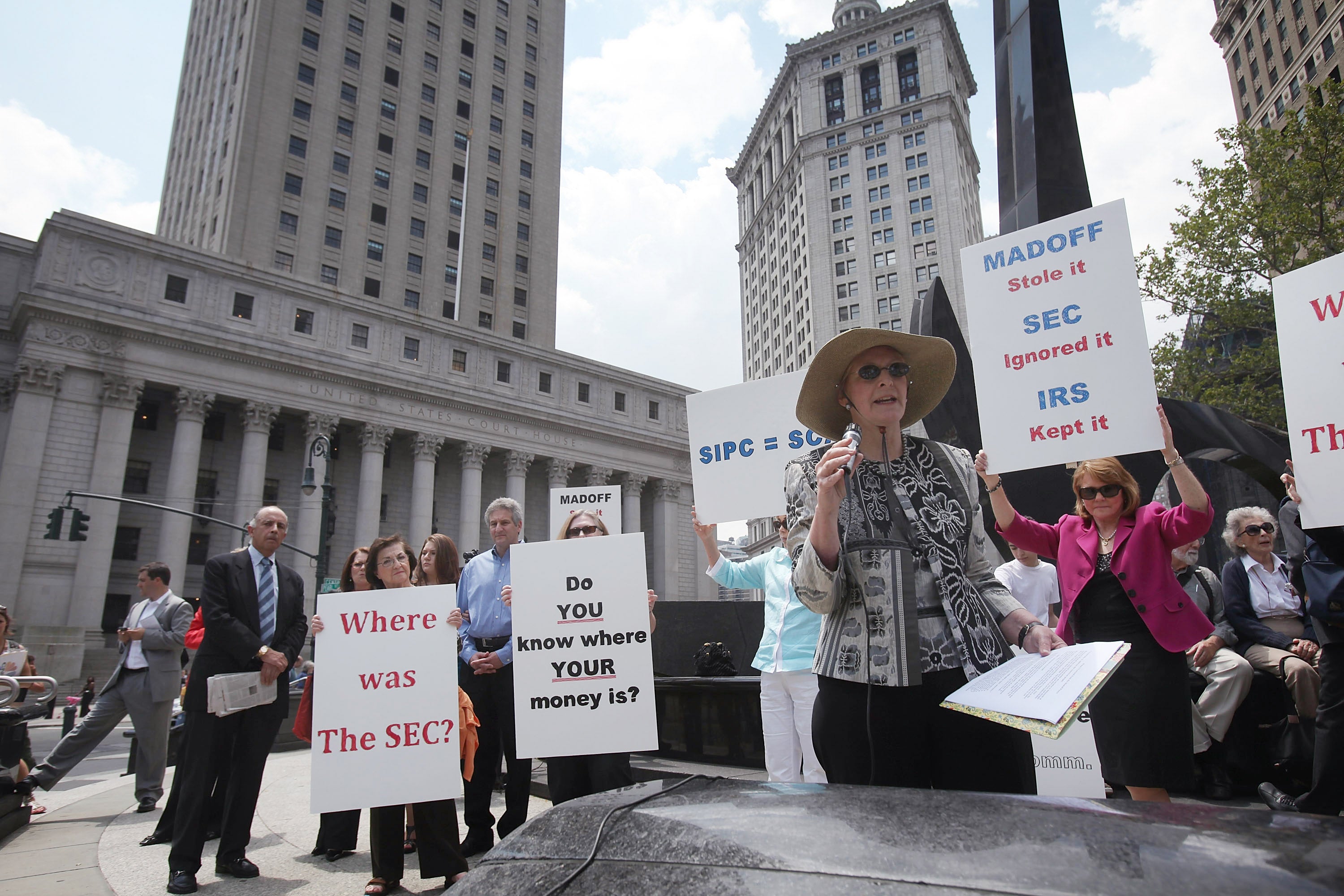 Bernard Madoff fraud victims hold a news conference following the sentencing, at Federal District Court in Manhattan on 29 June 2009