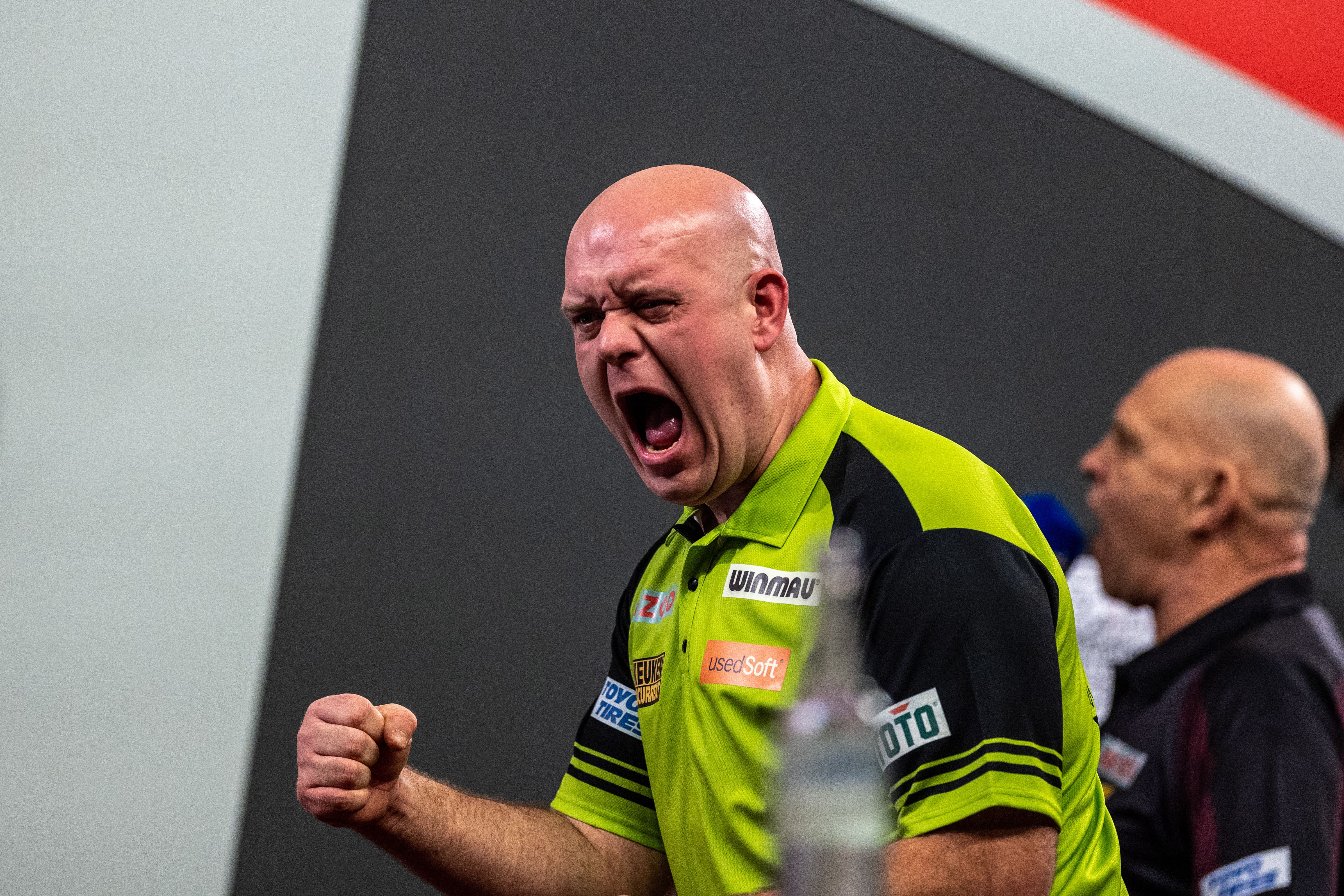 Michael van Gerwen celebrates after beating Dirk van Duijvenbode 4-1 (Steven Paston/PA).